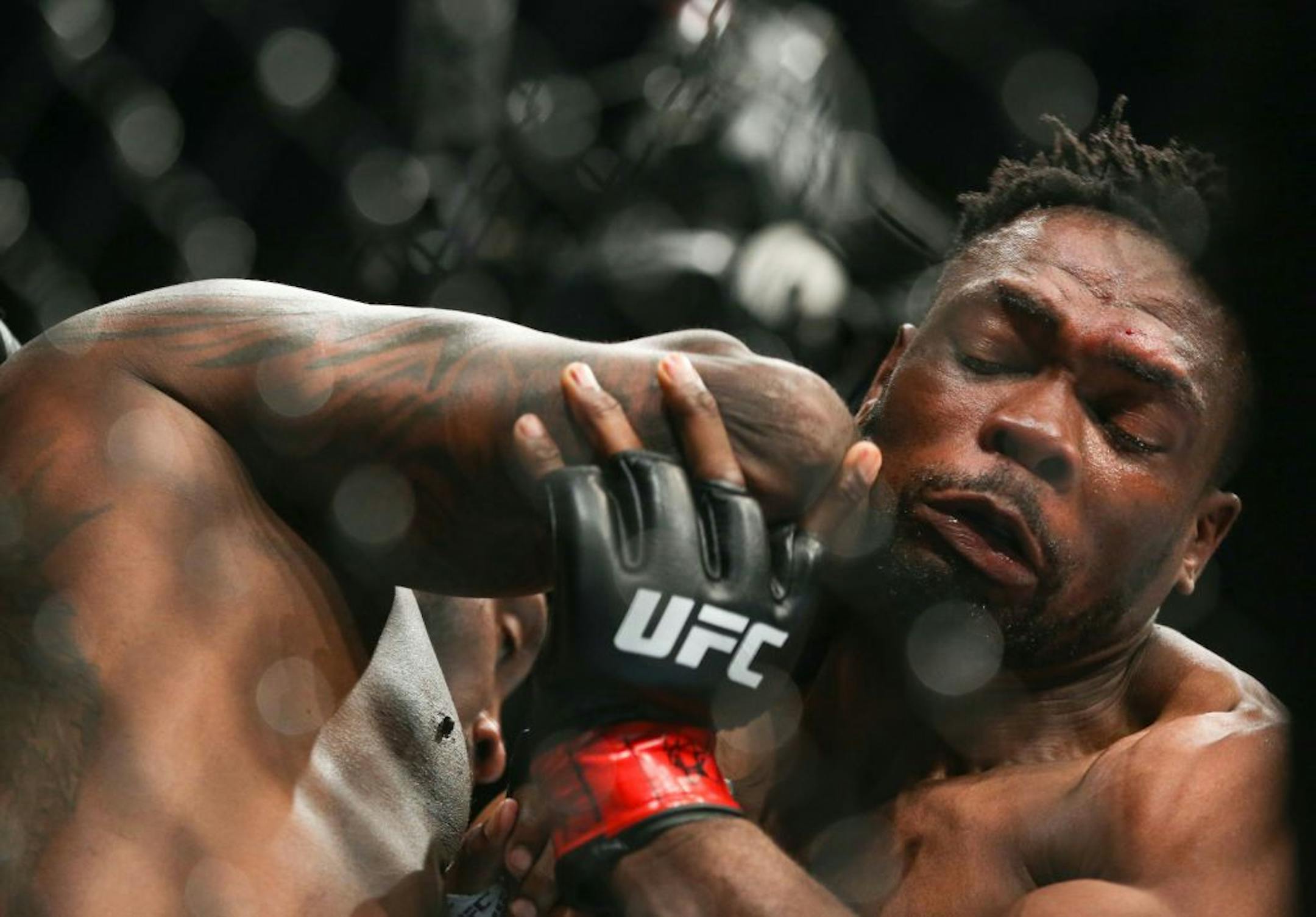 Datcha Lungiambula tries to defend himself from an elbow thrown by Dequan Townsend. Lungiambula would go on to win the match by TKO. ALEX KORMANN ¥ alex.kormann@startribune.com UFC Fight Night was held at Target Center on Saturday June 29, 2019. Francis Ngannou and Junior Dos Santos headlined the event.
