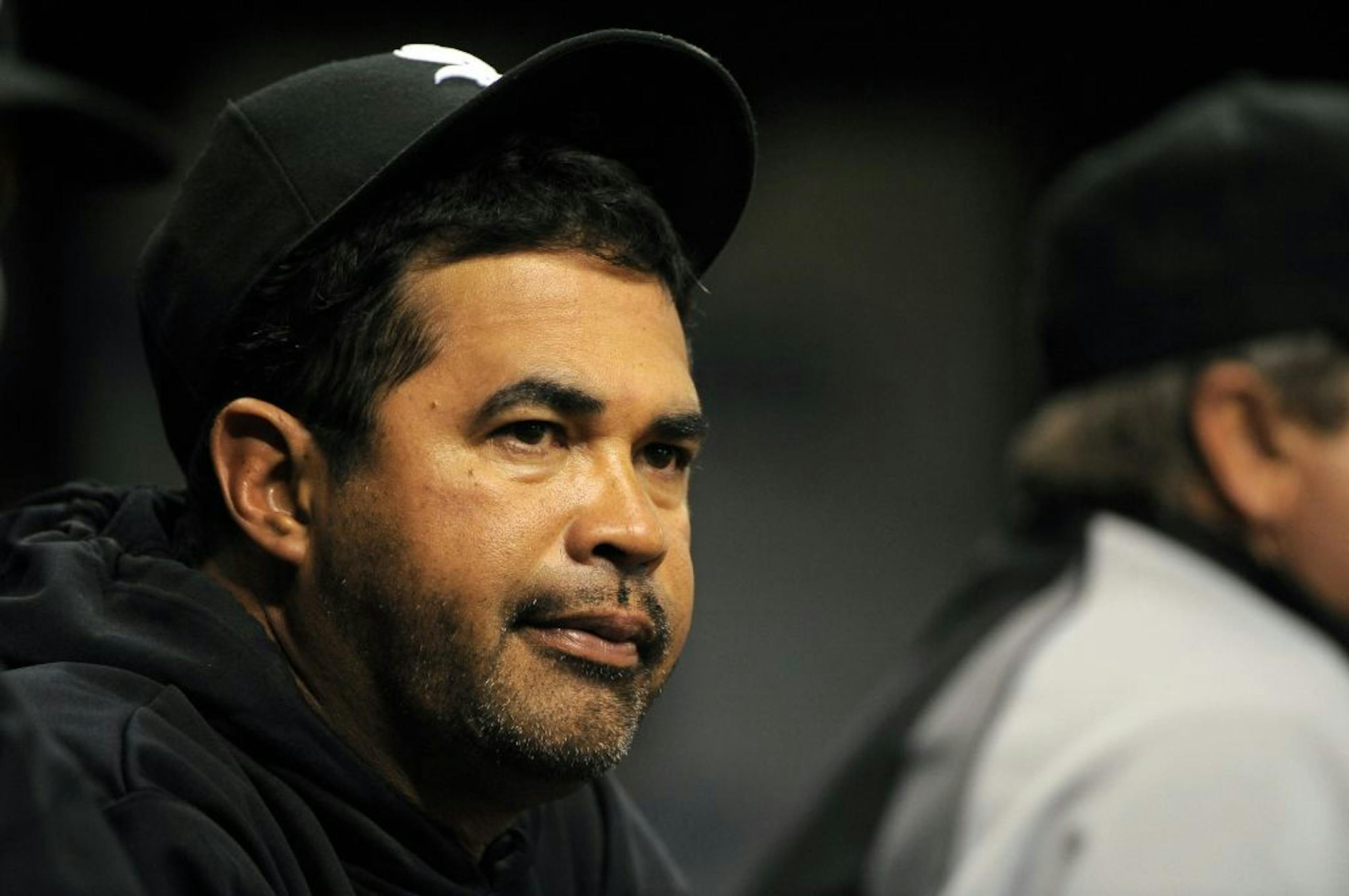 Chicago White Sox manager Ozzie Guillen looks on from the dugout during the final moments of their 4-1 loss to the Tampa Bay Rays during a Major League Baseball game on Wednesday, April 20, 2011, in St. Petersburg, Fla.