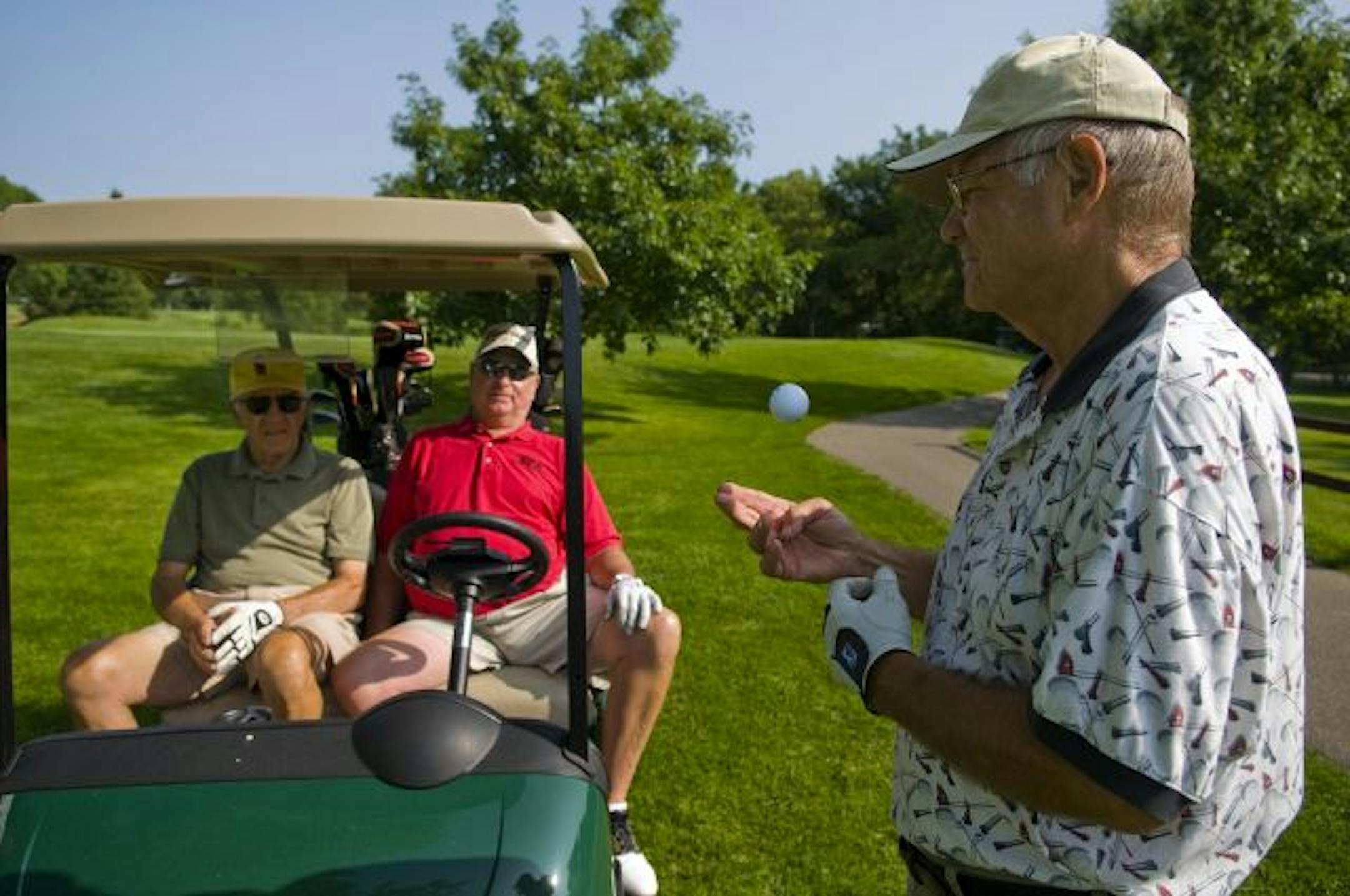 Paul Zollar, standing, Jerry Schlichting and Dick McDonald at Dwan. Municipal courses are counting on baby boomers to discover golf when they retire.