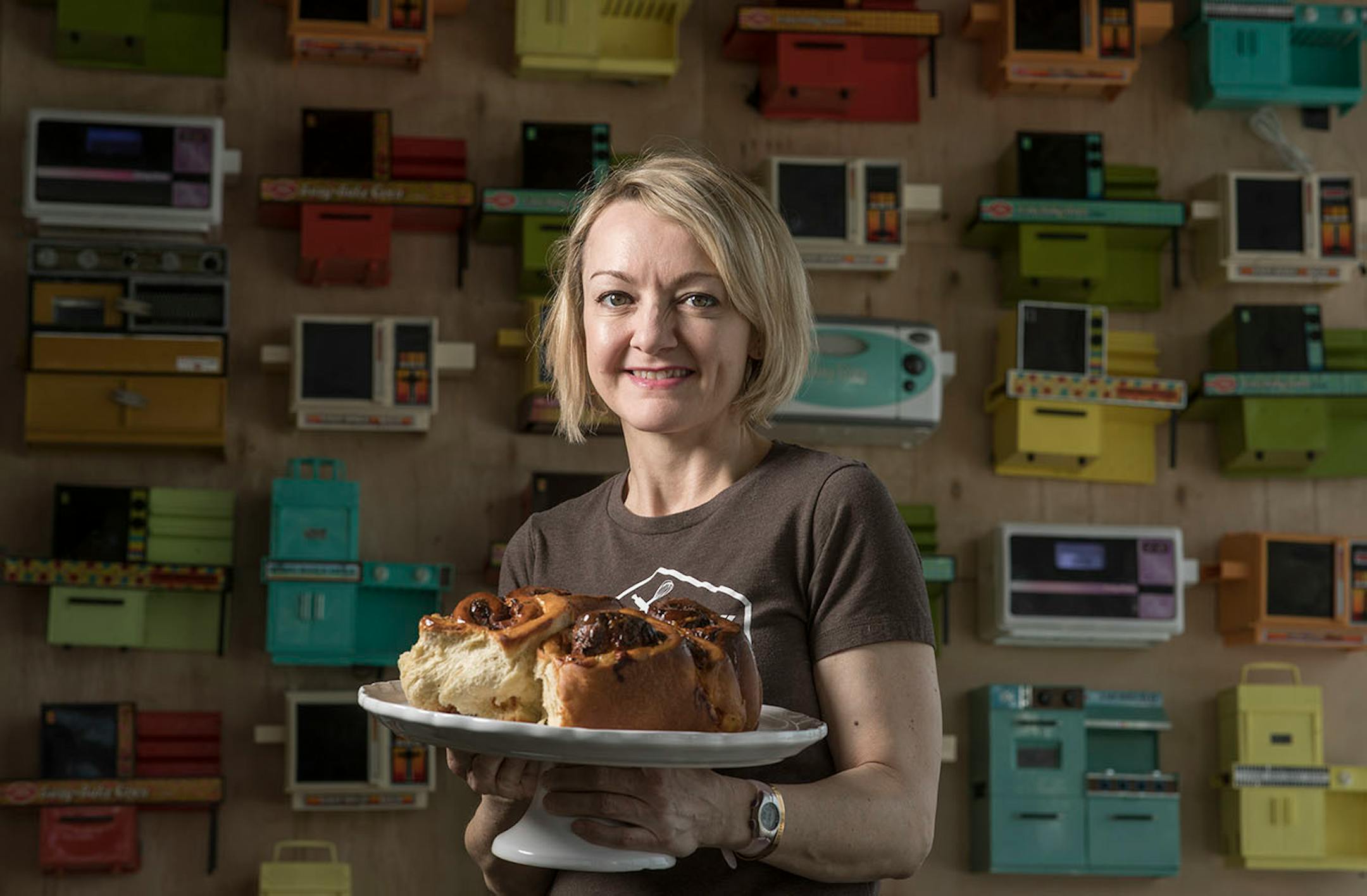 A portrait of Kristy Dirk owner of the Lucky Oven, in front of her wall of Easy-Bake oven Feb 9, 2018 in Minneapolis, MN.