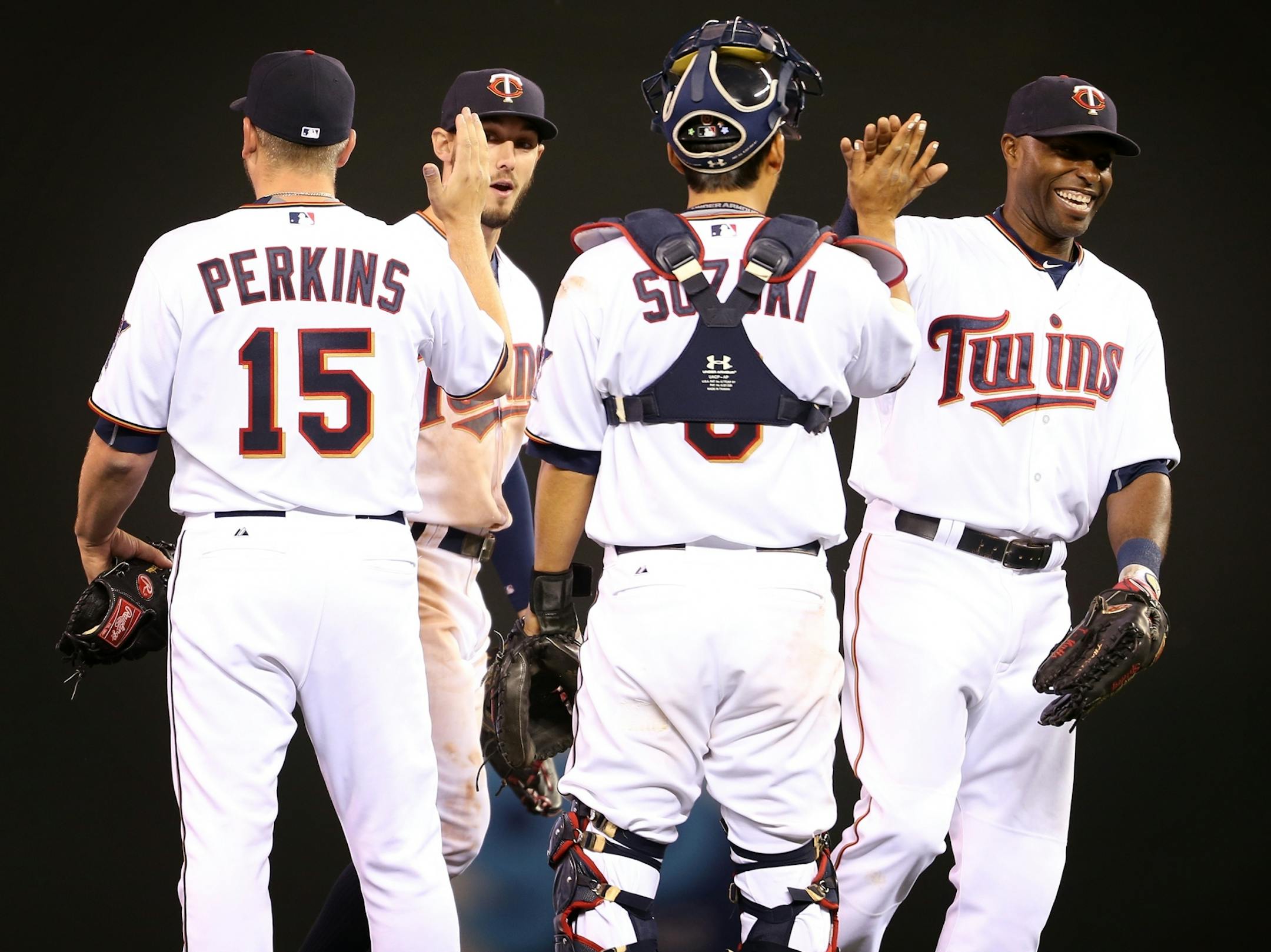 Minnesota Twins players celebrate their 8-7 win over the Oakland Athletics at Target Field in Minneapolis on Monday, May 4, 2015.