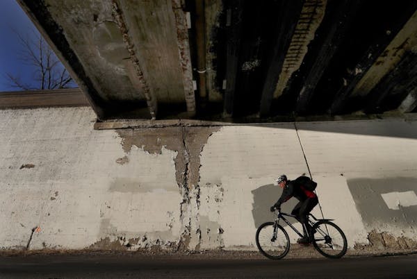 A cyclist riding on the Midtown Greenway passed under the Portland Avenue Bridge in Minneapolis on Feb. 14, 2017.