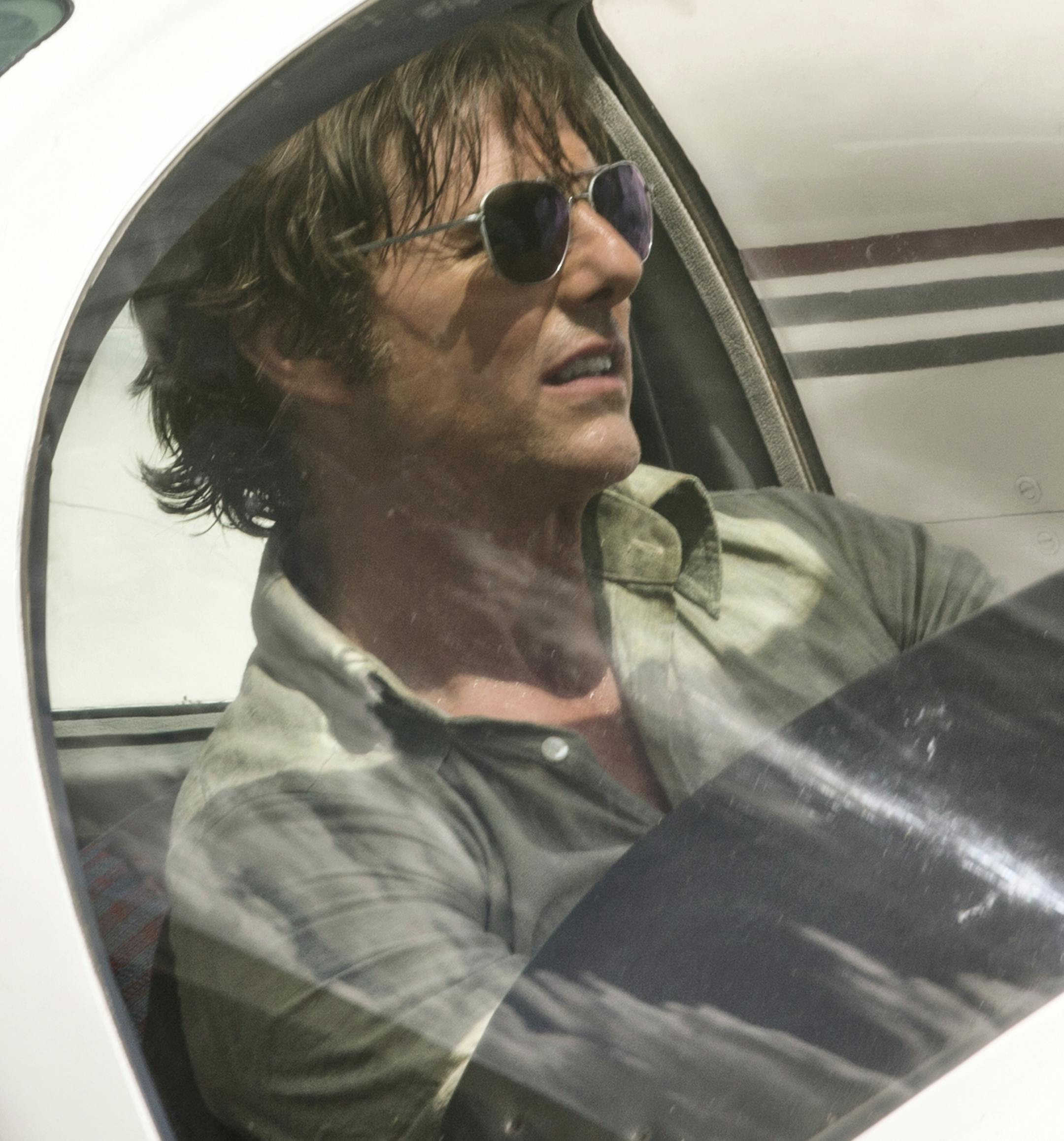 This image released by Universal Pictures shows Tom Cruise as Barry Seal in a scene from, "American Made." (David James/Universal Pictures via AP)