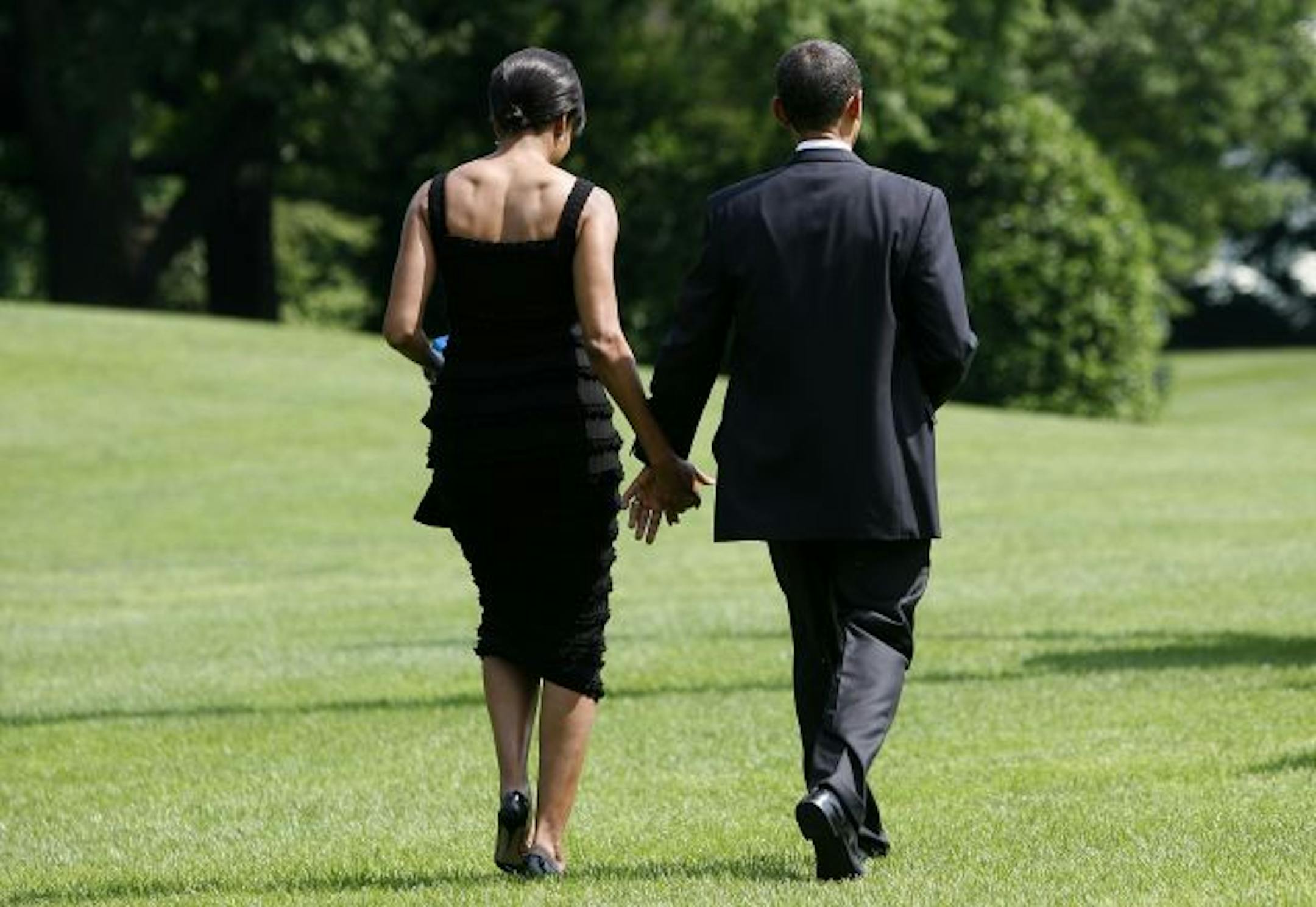 U.S. President Barack Obama and first lady Michelle Obama walk toward Marine One on the South Lawn of the White House on May 30, 2009 in Washington, DC. They traveled to New York City for their date night.