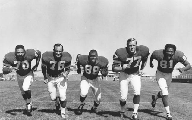 A photo of Jim Marshall, Paul Dickson, Alan Page, Gary Larsen and Carl Eller. Marshall, Page, Larsen and Eller later became known as the “Purple Peo