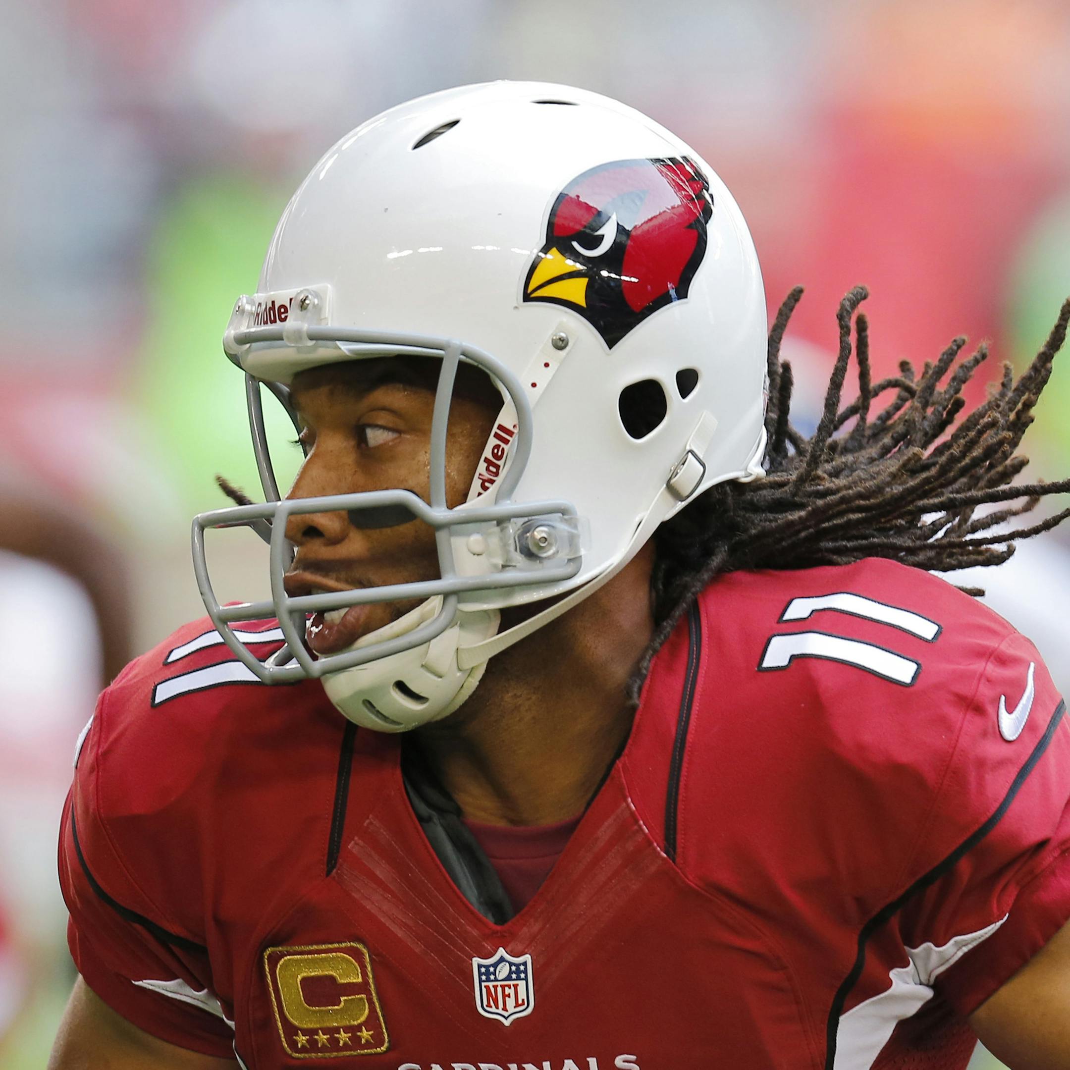 Arizona Cardinals wide receiver Larry Fitzgerald runs against the St. Louis Rams during the first half of an NFL football game, Sunday, Dec. 8, 2013, in Glendale, Ariz. (AP Photo/Matt York)