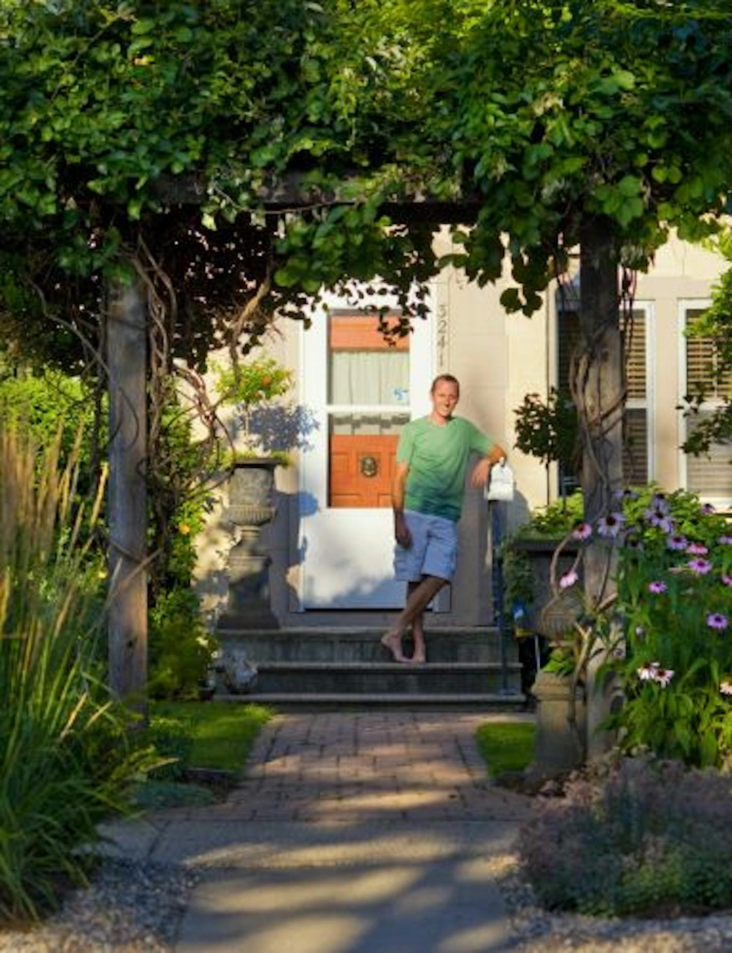 This small urban garden created by Randy Ferguson contains 100 fish and an antique shed relocated from the family farm.