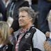 Actor Will Ferrell, center, watches a match at the BNP Paribas Open tennis tournament Wednesday, March 14, 2018, in Indian Wells, Calif.