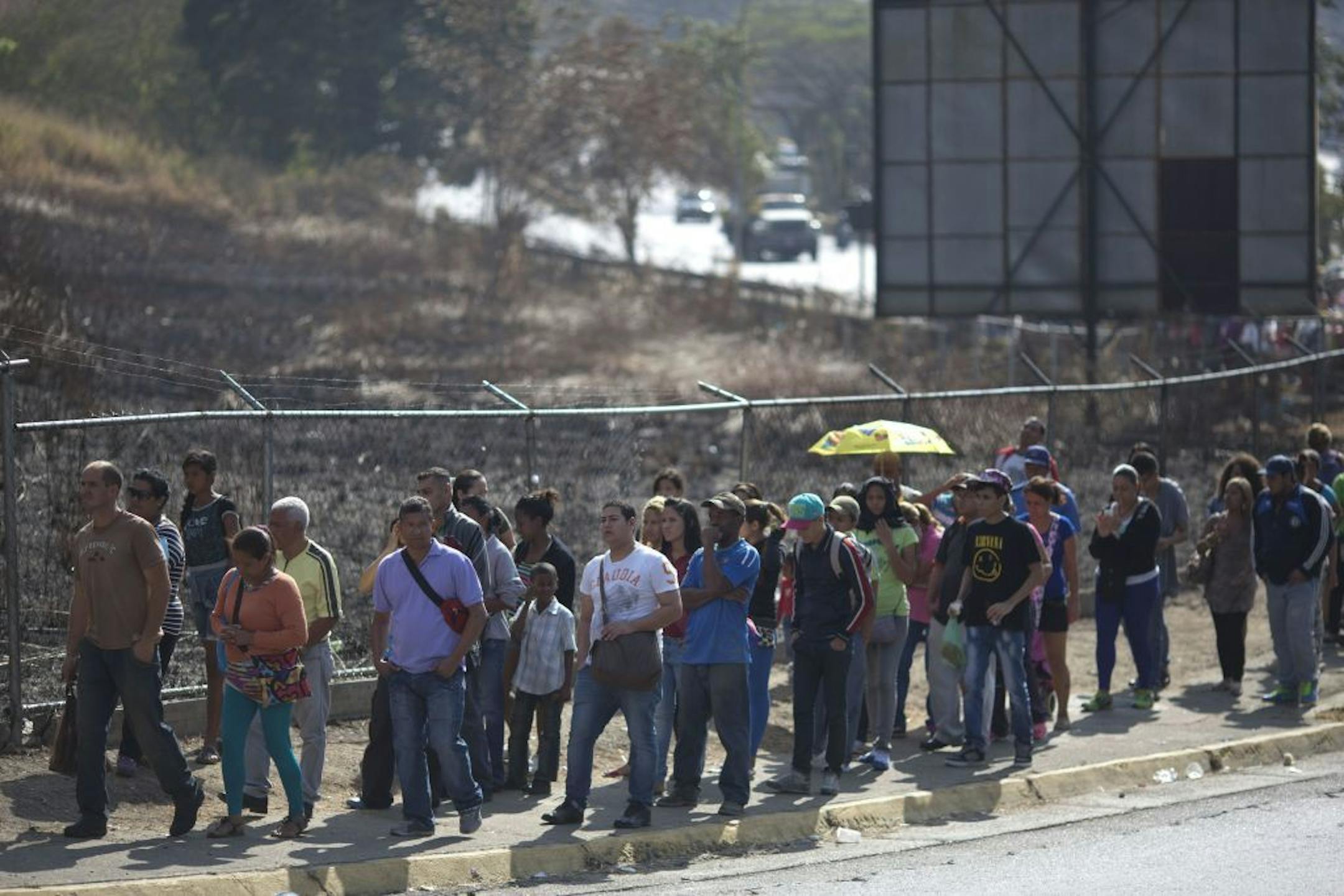 People wait in line to buy products at government regulated prices in Caracas, Venezuela, Friday, Feb. 19, 2016. Venezuela�s government is raising gasoline prices sixtyfold the first increase of any kind in more than 17 years. President Nicolas Maduro also agreed to an increase of 20% of the minimum wage and pensions, among other reforms. Venezuela is in the midst of a widespread economic crisis.