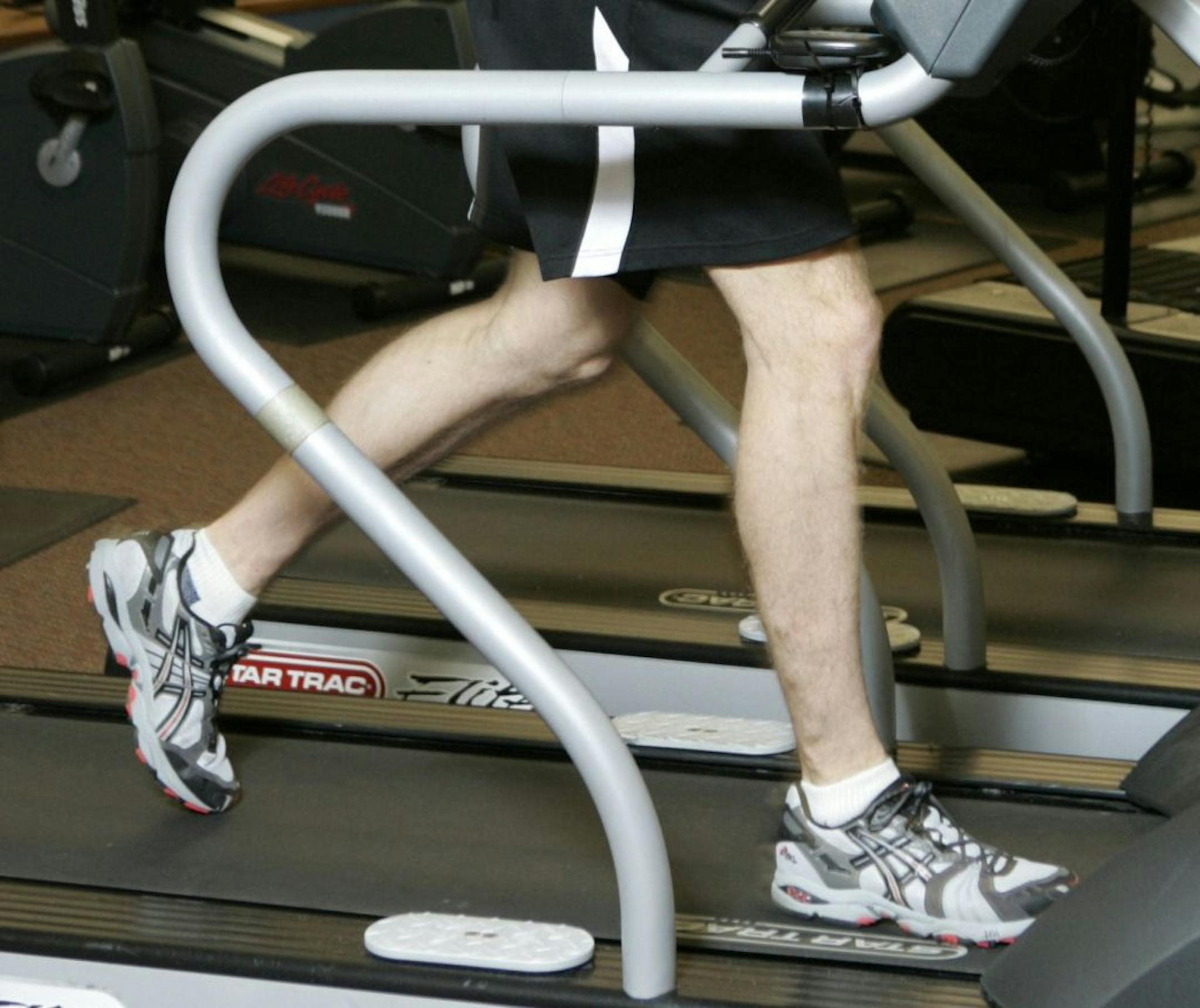 Matt Bartz, athletic director at Le Club, in Milwaukee, Wisconsin, demonstrates the correct way to use a treadmill, April 19, 2006.