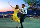 This image released by Lionsgate shows Ryan Gosling, right, and Emma Stone in a scene from, "La La Land."