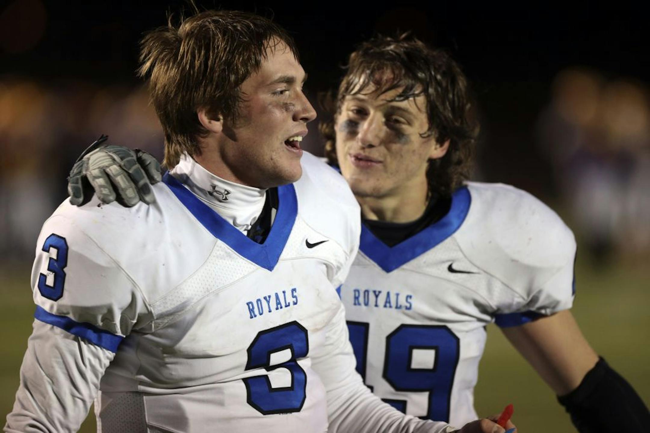 Woodbury quarterback Sawyer Moon (3) and teammate Geno DeMike