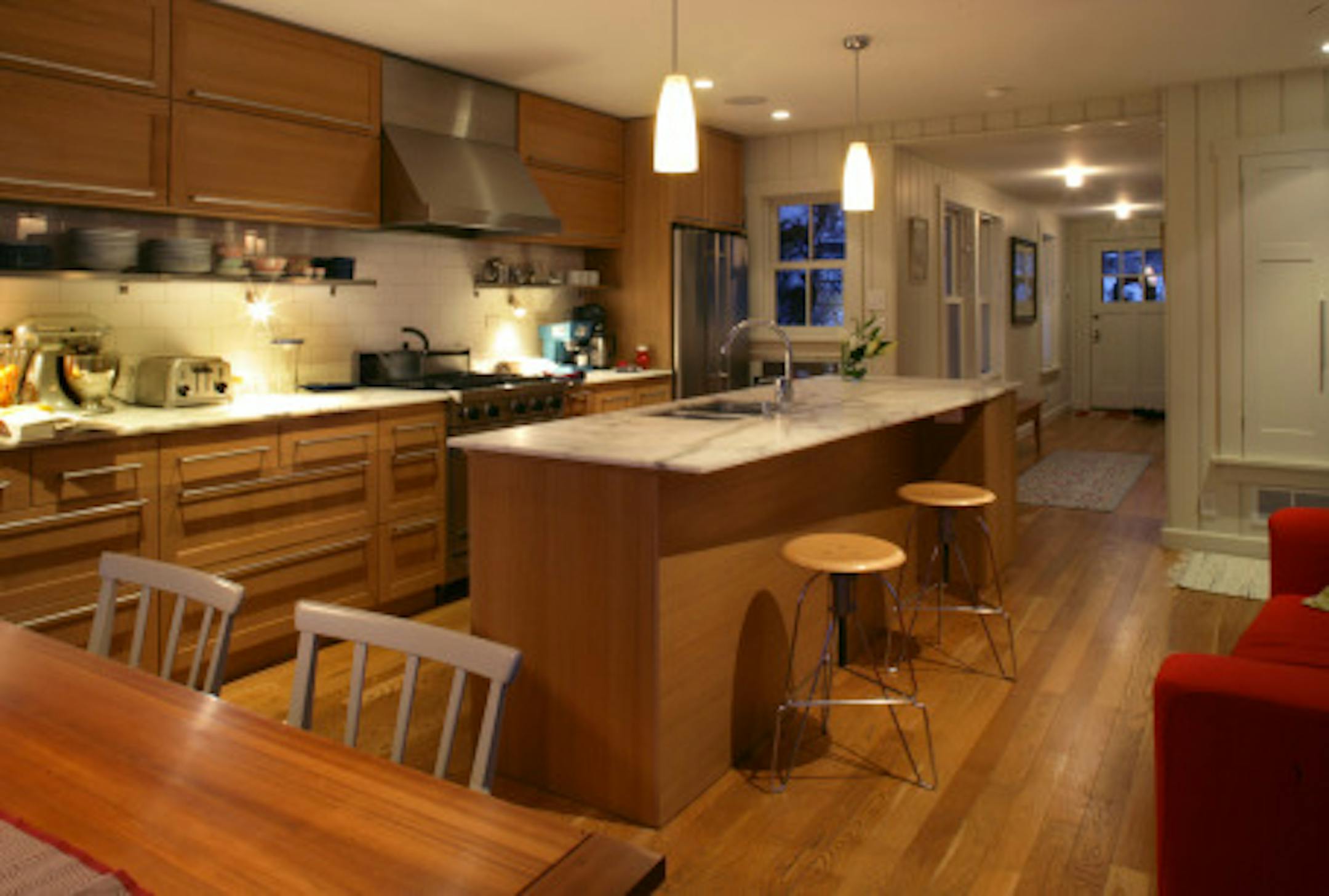 joel koyama'jkoyama@startribune.com aia0103 20010582a]  'Kitchen looking toward the entry.  Architects Todd Hansen and Christine Albertsson's remodeled Linden Hills home is the AIA Home of the Month. Shoot a family portrait (with their two children) and a couple of details.