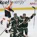 Minnesota Wild's Eric Staal looks to teammate Jonas Brodin in celebration after Staal scored a goal against the Philadelphia Flyers in the first perio