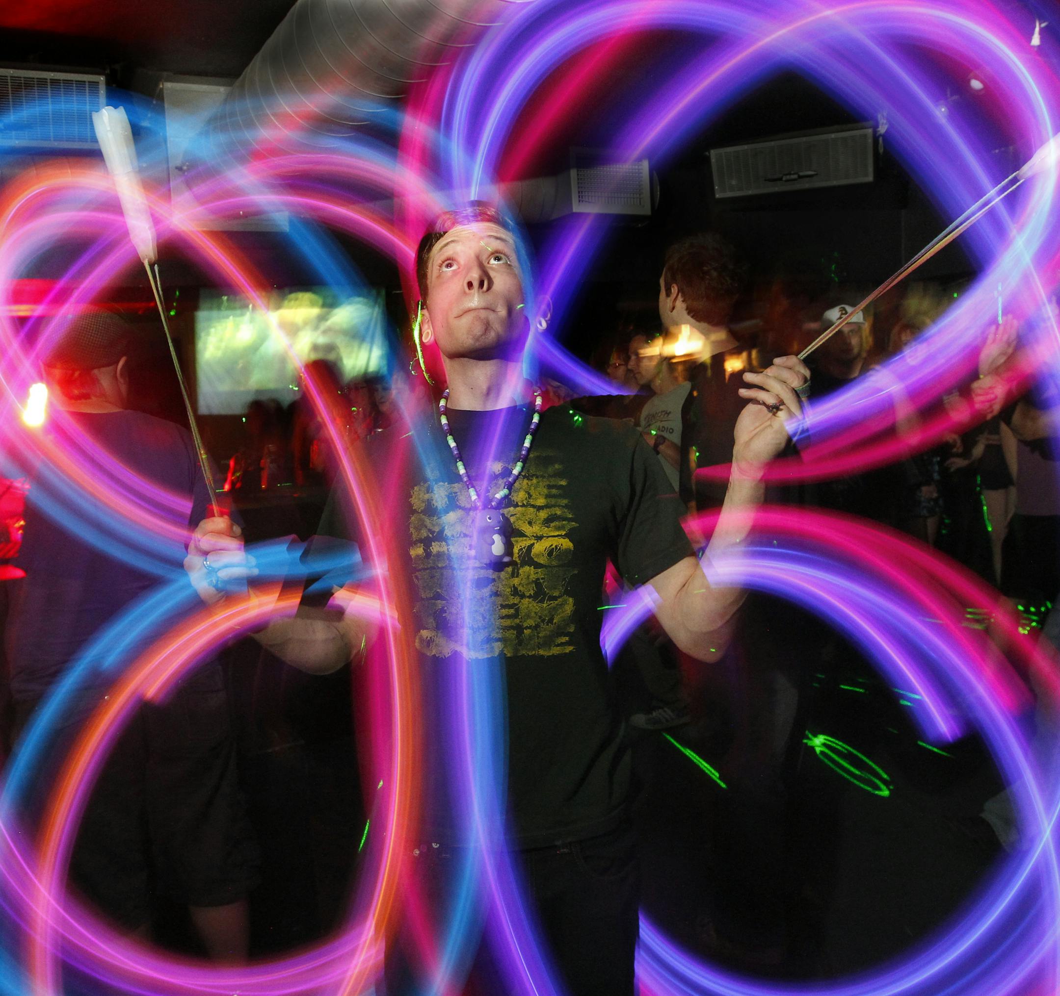 During a Konkrete Jungle show at First Ave, dancers stepped to the music‚Äôs heavy beat, some with props. Justin T. Reiman, Nickname, "Wings" spins his lights while he steps to the music. ] TOM WALLACE ‚Ä¢ twallace@startribune.com __Assignments #20019427A_ August 24, 2011_ SLUG: vitadubdanceXXXX_ EXTRA INFORMATION: