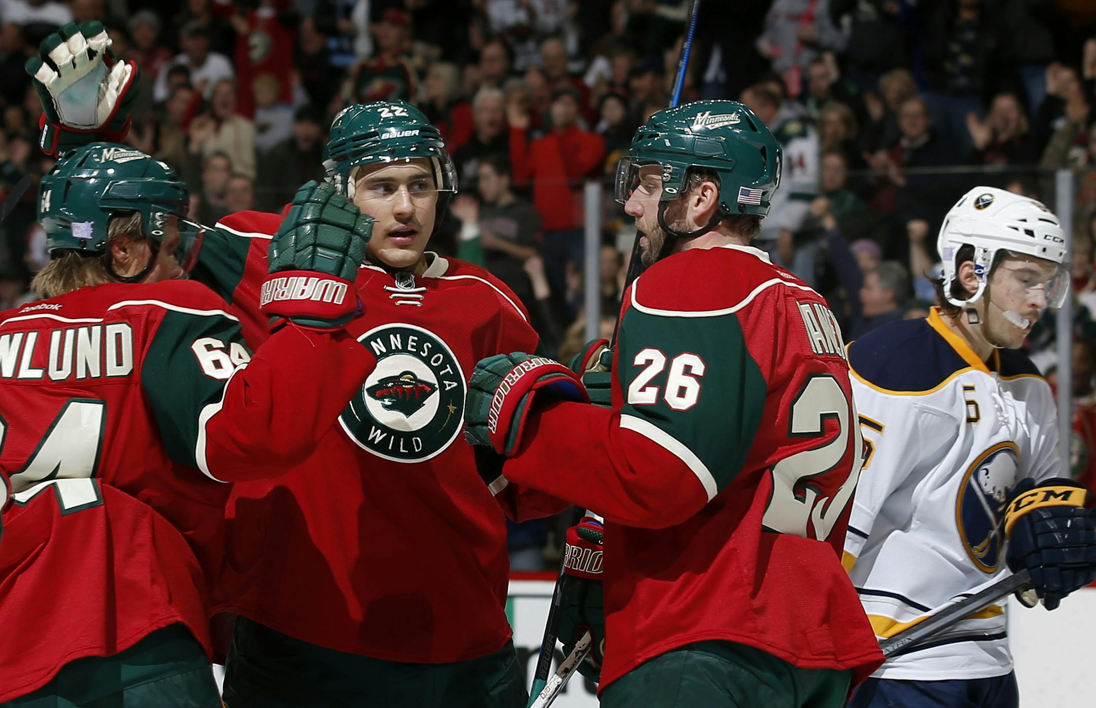 Nino Niederreiter (22) celebrated with teammates Mikael Granlund (64) and Thomas Vanek (26) after scoring his second goal of the first period. ] CARLOS GONZALEZ cgonzalez@startribune.com - November 13, 2014, St. Paul, Minn., Xcel Energy Center, NHL, Minnesota Wild vs. Buffalo Sabres