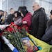 People pay their final respects to Vadim Zherebilo, who was killed in fighting against Russian-backed separatists, during a commemoration ceremony in 