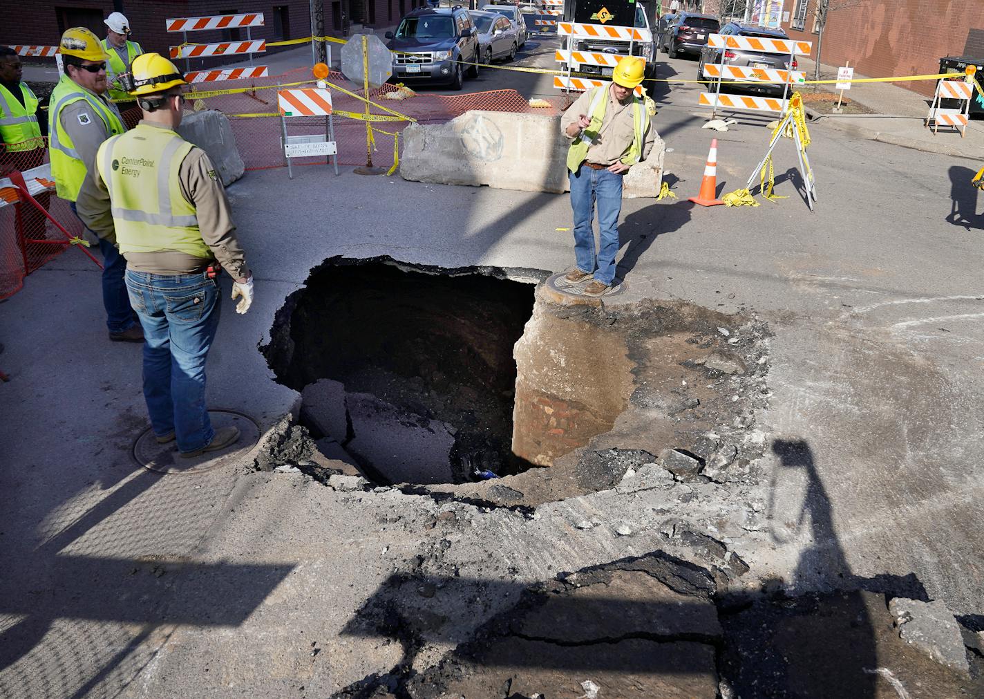 On April 10, utility workers surrounded a sinkhole roughly 10 feet deep and 5 feet wide that opened up in the middle of the intersection of W. 27th Street and Girard Avenue S. in Uptown Minneapolis.