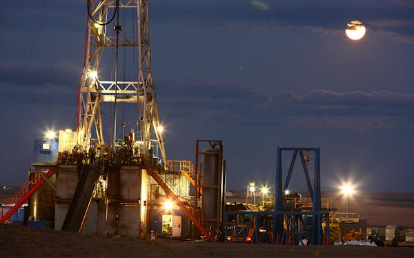 An oil drilling rig stands on the Bakken formation in Watford City, North Dakota, U.S., on Wednesday, Oct. 12, 2011. Oil production in the state has t