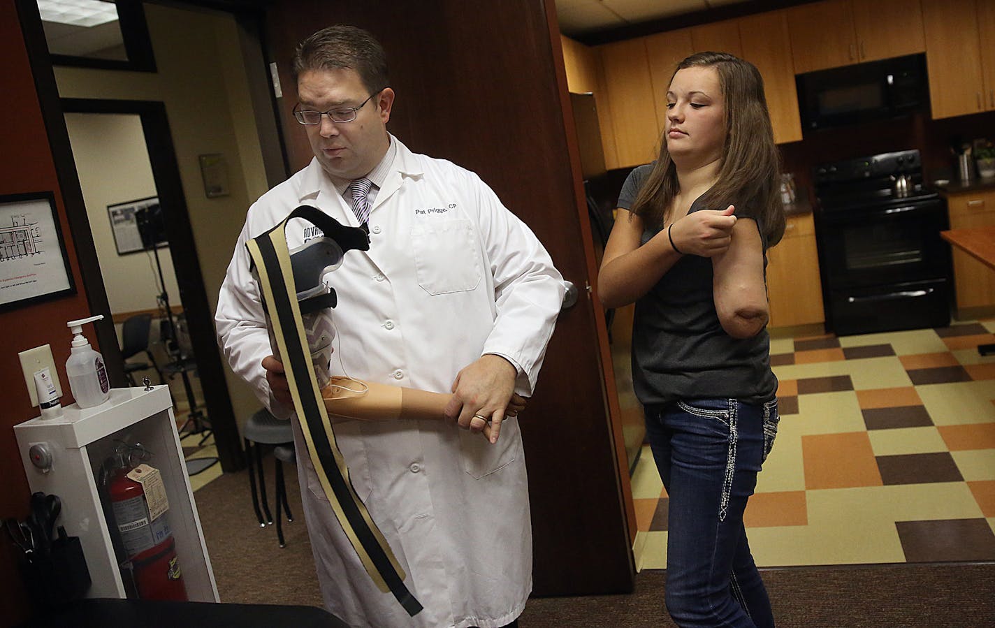 Pat Prigge, clinical manager at Advanced Arm Dynamics in Maple Grove, worked with Kate Jorgenson during rehab session. ] JIM GEHRZ &#xef; james.gehrz@startribune.com / Maple Grove, MN / September 16, 2015 / 10:00 AM BACKGROUND INFORMATION: A 13-year-old girl has reached a milestone as the youngest patient in the world to receive a new-age prosthetic arm -- one that requires more surgery but results in more connections to nerves and more intuitive and effective motions. On Wednesday, she will be