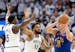 Anthony Edwards (5) and Karl-Anthony Towns (32) of the Timberwolves defend Denver's Nikola Jokic (15) during Game 6 of the NBA Western Conference semi