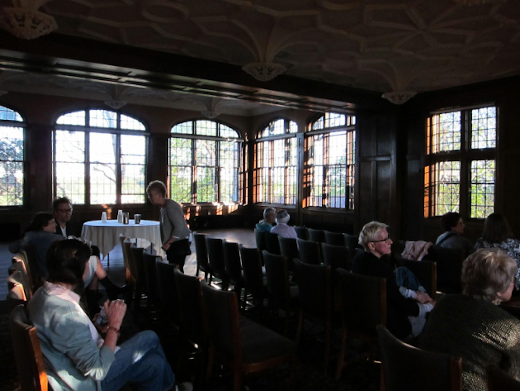 All the chairs filled, and the audience spilled over to ledges along the wall.