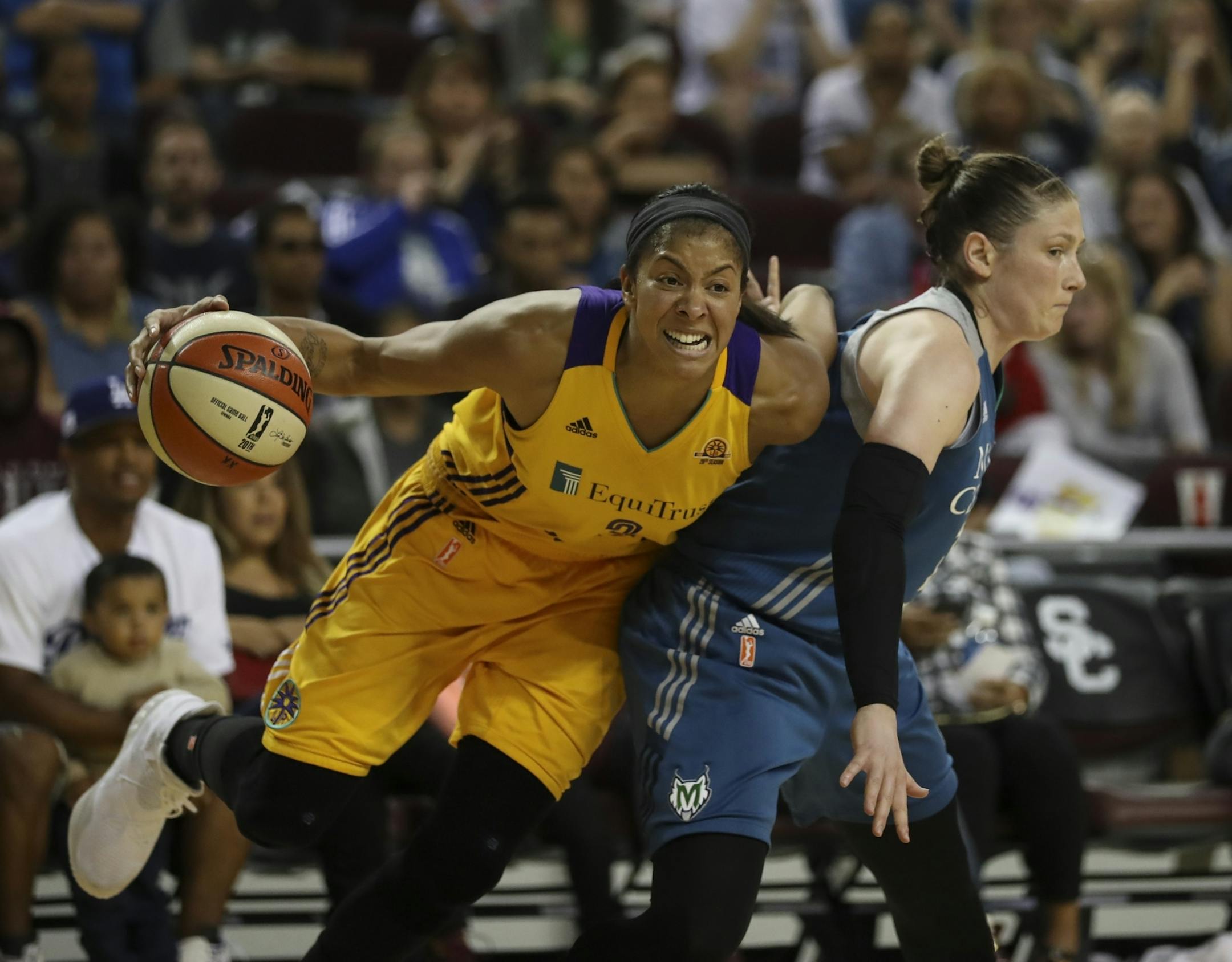 Los Angeles Sparks forward Candace Parker (3) was fouled by Minnesota Lynx guard Lindsay Whalen (13) in the second half. Parker led all scorers with 24 points.
