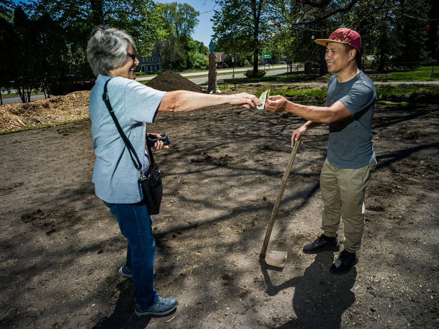 Pat Carley, who read about the garden, gave Quentin Nguyen a donation. "I think we should be doing this all over," she said.