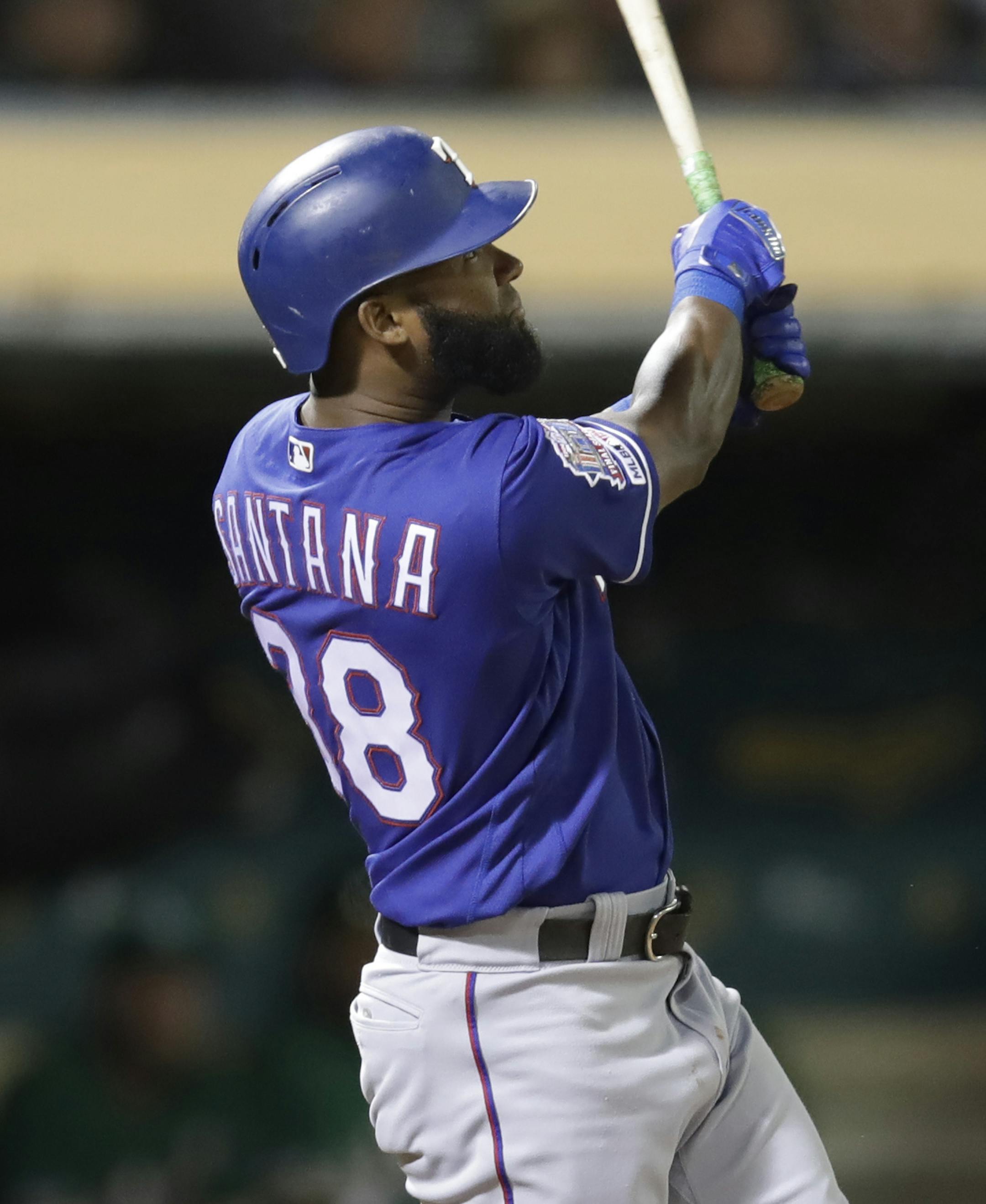 Texas Rangers' Danny Santana watches his grand slam hit off Oakland Athletics' Wei-Chung Wang in the sixth inning of a baseball game Thursday, July 25, 2019, in Oakland, Calif. (AP Photo/Ben Margot)