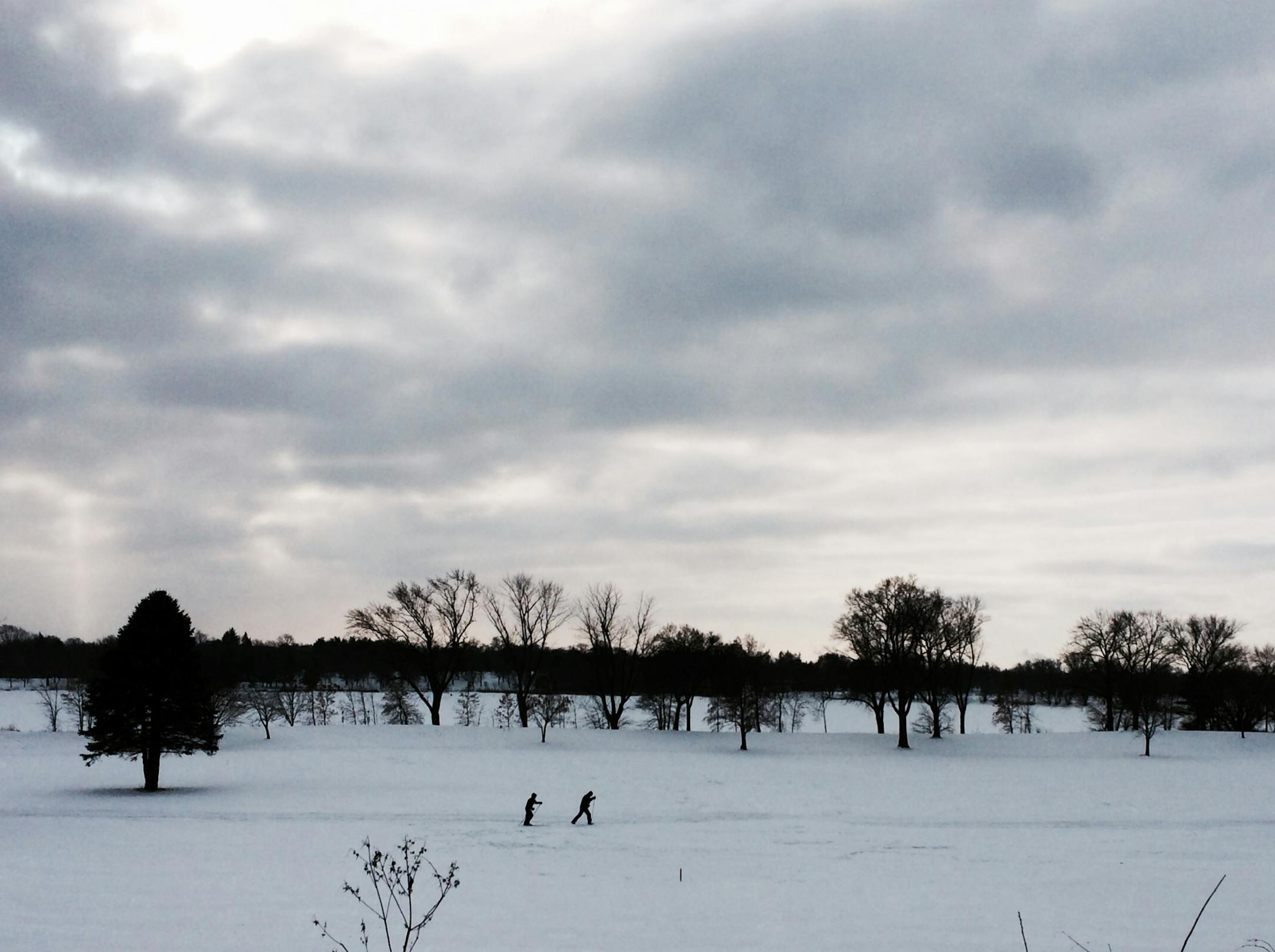 Two cross country skiers took advantage of the relative warm of 16 degrees at Lake Hiawatha Golf Course in Minneapolis on Saturday morning. Extreme cold, with wind chills around 50 below zero are expected Sunday night and into Monday.