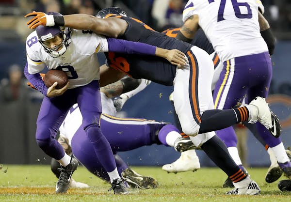 Sam Bradford (8) was sacked by Akiem Hicks (96) in the fourth quarter against the Bears.