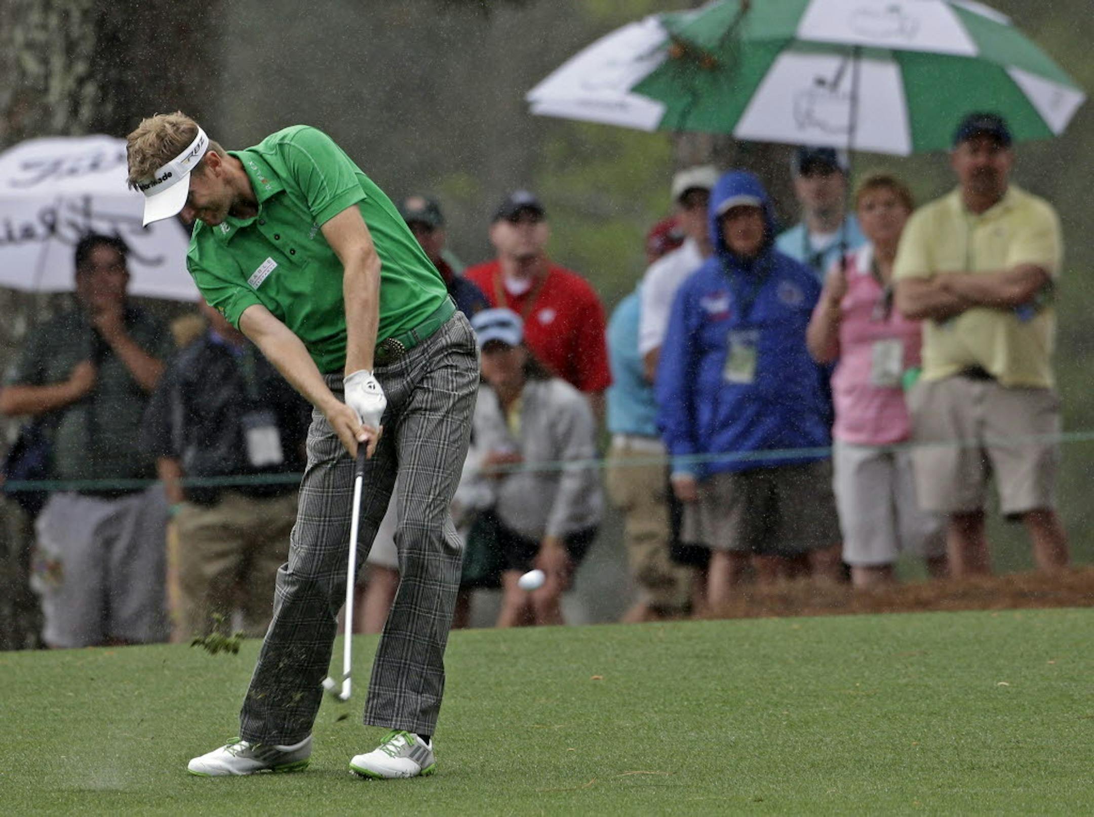 David Lynn, of England, takes his shot on the first fairway during the second round of the Masters golf tournament Friday, April 12, 2013, in Augusta, Ga.