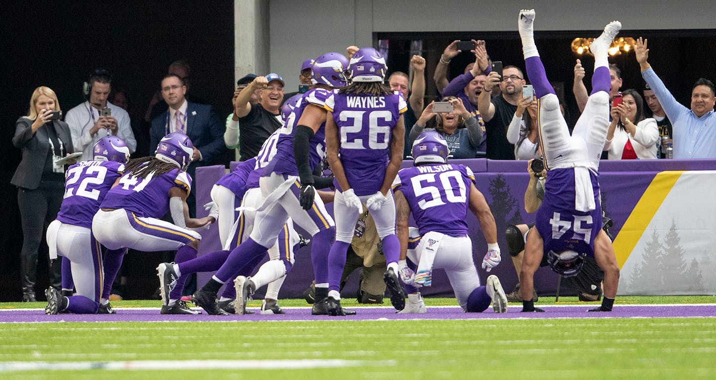 The Vikings defense celebrates an interception in the Philadelphia Eagles' end zone in the fourth quarter