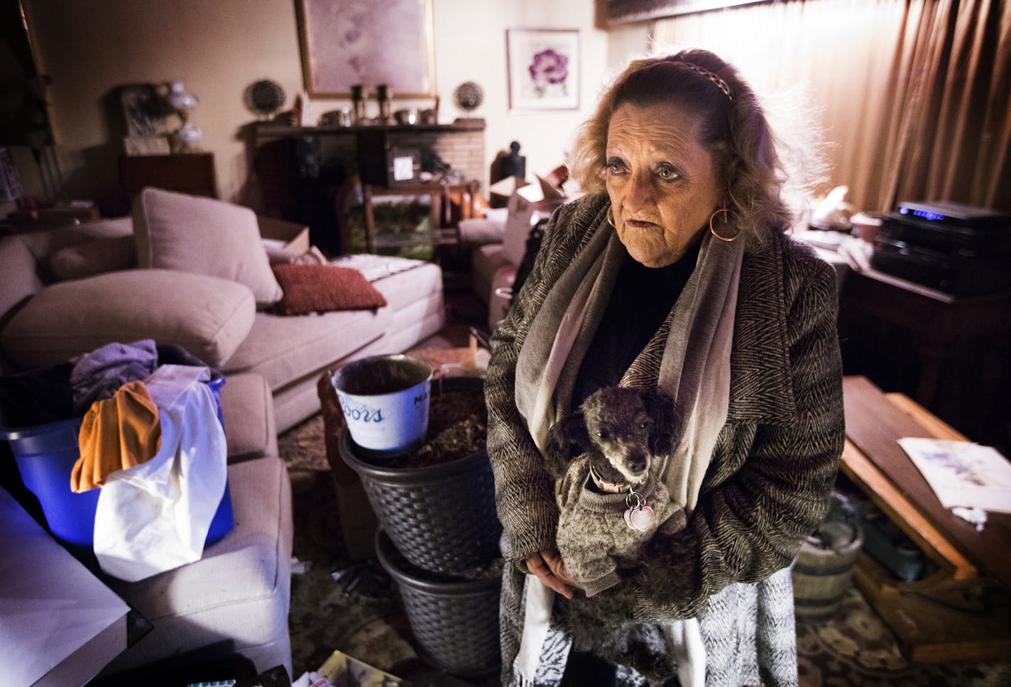 Sandra Hart holds her dog Peppermint while accessing the damage to her home. ] LEILA NAVIDI &#xef; leila.navidi@startribune.com BACKGROUND INFORMATION: Sandra Hart and her son Matthew get back into their Minneapolis home on Tuesday, February 6, 2018. Hennepin County's Housing Court overstepped its authority when a referee ordered Hart to abandon her property because of criminal activity, the state Court of Appeals ruled last week. The county declared that Sandra Hart's house was a public nuisanc