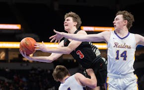 Farmington’s Ryan Beckwith (3) is called for a charge after running over Cretin-Derham Hall guard Miles Bollinger while being pursued by guard Aidan