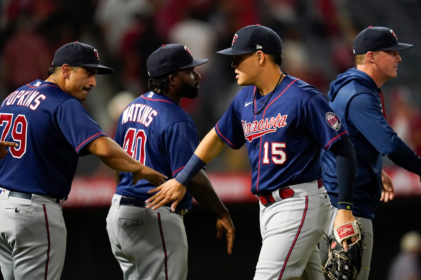 Minnesota Twins third baseman Gio Urshela (15) celebrates with teammates after a 4-0 win over the Los Angeles Angels in a baseball game in Anaheim, Calif., Friday, Aug. 12, 2022. (AP Photo/Ashley Landis)