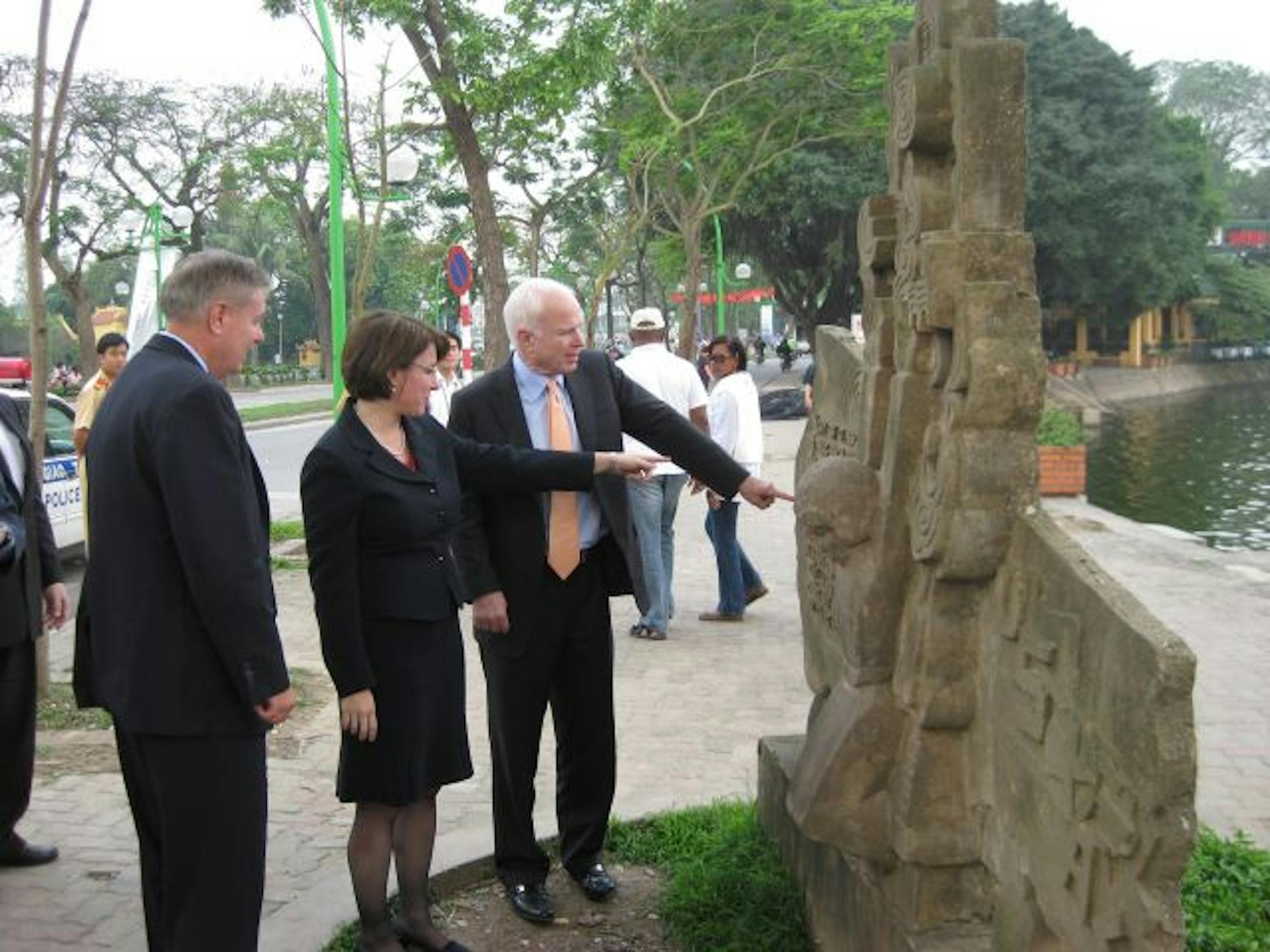 From left, Sens. Lindsey Graham, R-S.C.; Amy Klobuchar, D-Minn., and John McCain, R-Ariz., visited Truc Bach Lake in Hanoi, where John McCain was shot down on Oct. 26, 1967. The three are visiting Vietnam, China and Japan to discuss economic and security issues.
