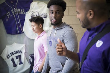 Future Dougherty Family College students Brian Ngo and Zakaria Elmi chat with dean Alvin Abraham during a tour Friday. The new two-year school at the 