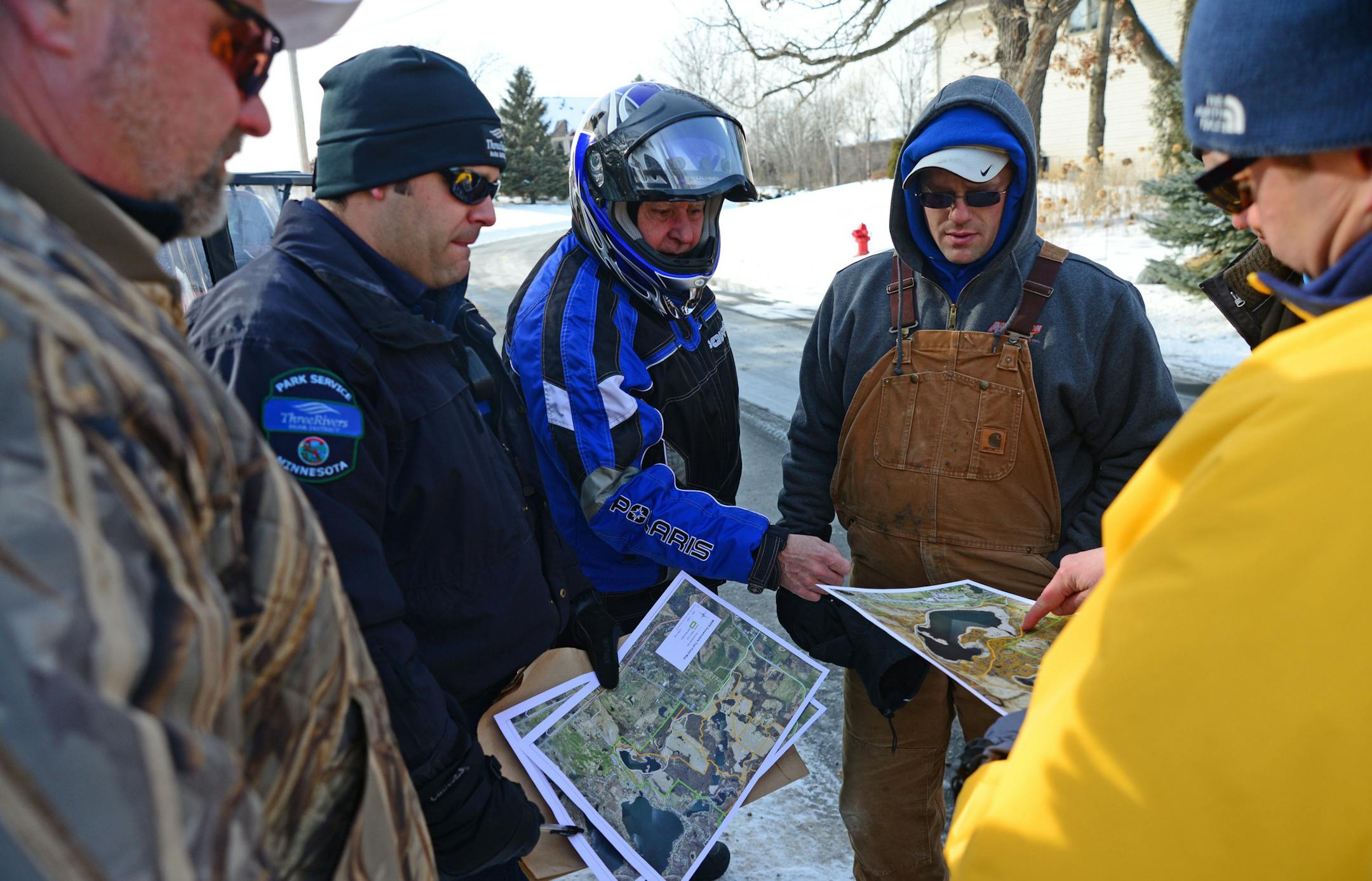 Terry Ege, Dario DePaz, park service officer, Kim Werkmeister, Brad Chock and Scott County Parks Chief Mark Themig looked over ski-mobile trail maps out in front of Rota Hart's driveway. At the age of 71, after half a century in America, Rota Hart is leading her very first civic uprising. "In Europe you can walk anywhere, they want you to walk in the woods and enjoy nature," the Vienna-born resident of Lakeville, says. "I come to this huge America and I can't walk in the woods? It doesn't seem r