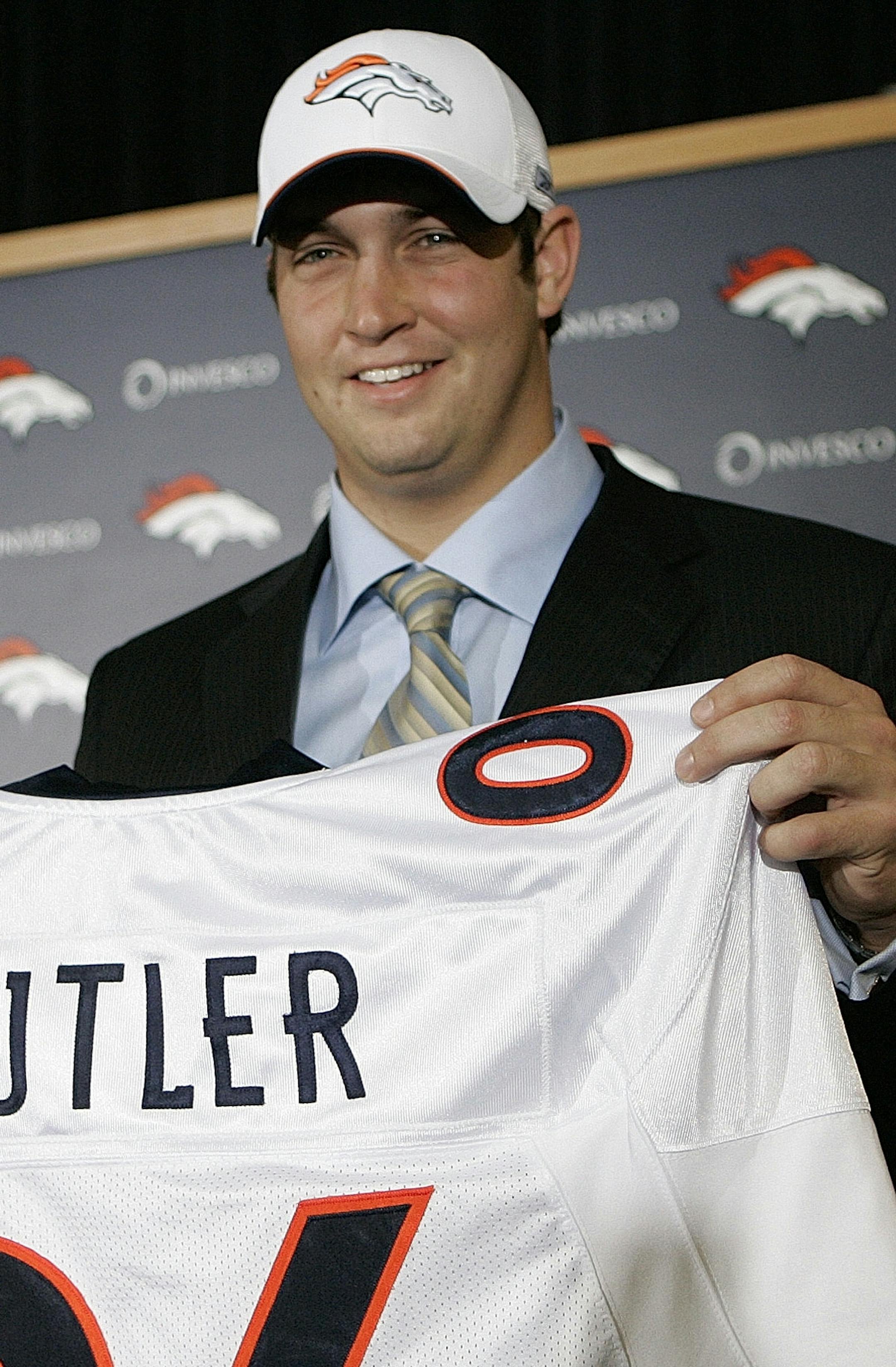 Jay Cutler, a quarterback from Vanderbilt, sports a Denver Broncos cap and shows off a jersey bearing his name after a news conference at the Broncos' headquarters in Denver, on Sunday, April 30, 2006. Cutler was the Broncos first round draft pick and the 11th player chosen on Saturday. (AP Photo/Ed Andrieski) ORG XMIT: COEA104