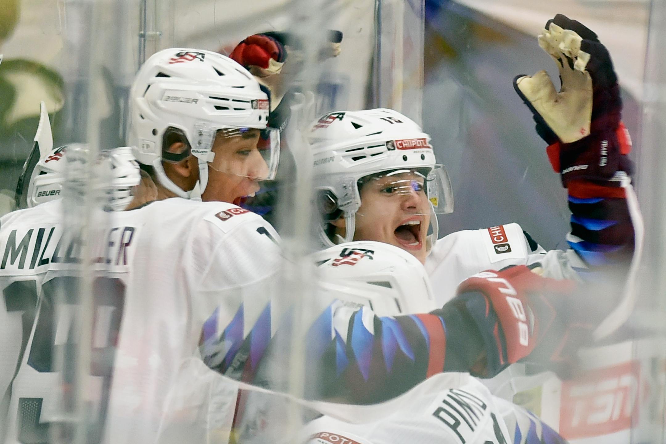 Cole Caufield, right, of the United States celebrated his game-winning goal with teammate K'Andre Miller during the 2020 IIHF World Junior Ice Hockey Championships Group B match between the United States and Czech in Ostrava, Czech Republic, on Monday.