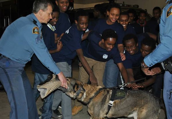 St. Paul junior police academy participants learn about the police's K-9 unit during one of their sessions.