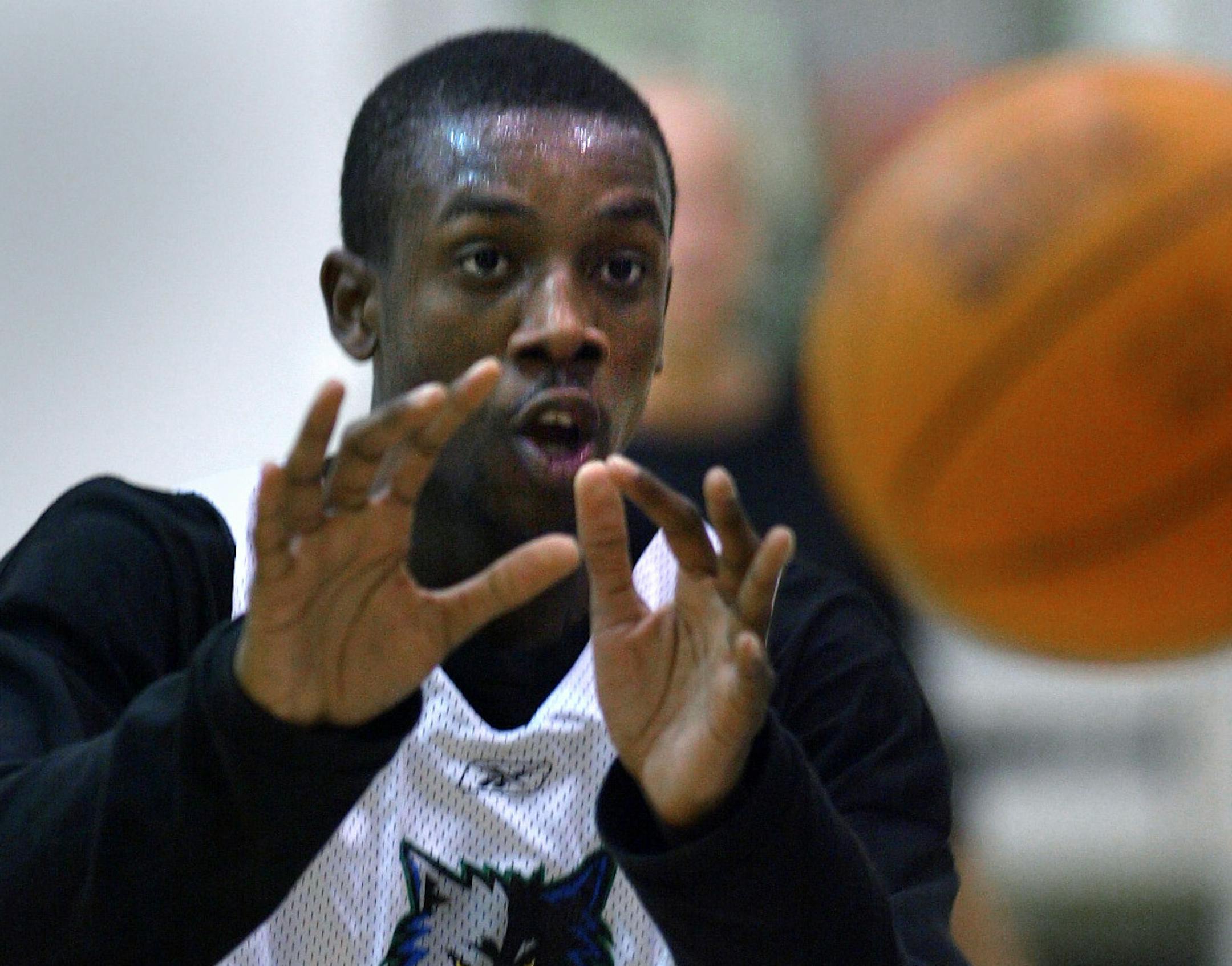 Minneapolis, MN., Tuesday, 9/30/2003. Ndudi Ebi made a pass during the rookie and young player Timberwolves workout at Target Center.
