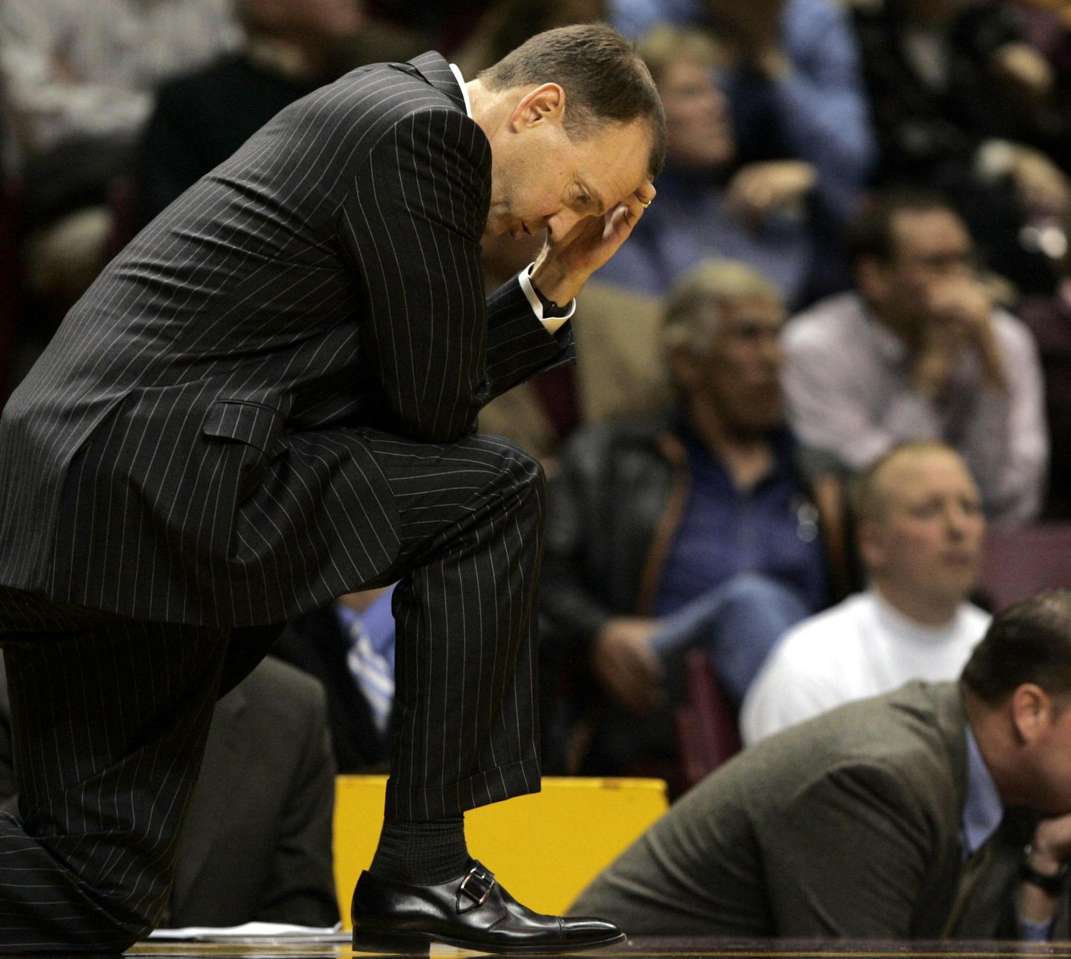 CARLOS GONZALEZ • cgonzalez@startribune November 29, 2006 - Williams Arena – Minneapolis, MN – University of Minnesota vs. Clemson – Minnesota head coach Dan Monson, took a knee in the 2nd half of Wednesday night’s game. Clemson beat Minnesota by a final score of 90-68.