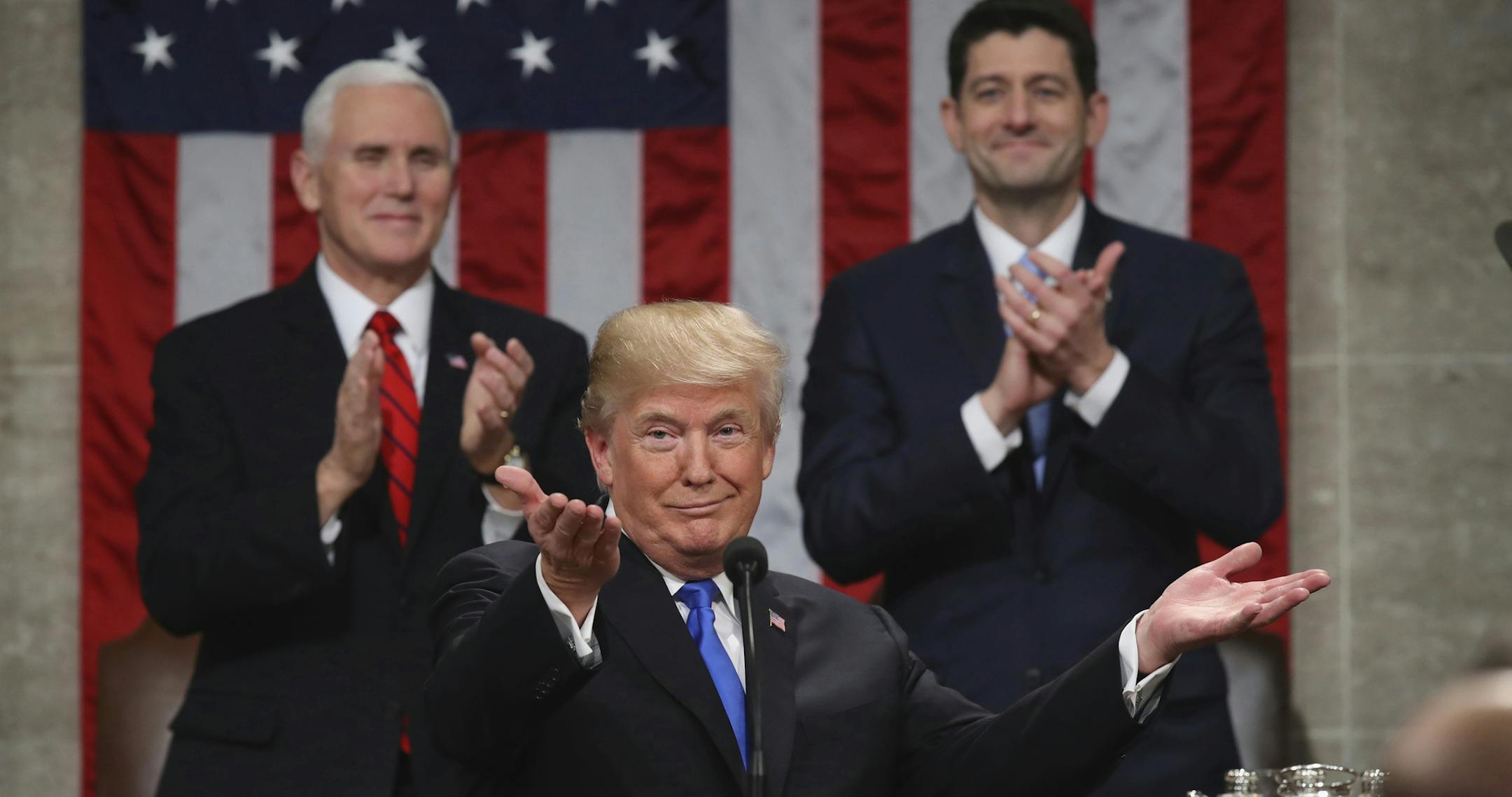 FILE - In this Jan. 30, 2018, file photo, President Donald Trump gestures as delivers his first State of the Union address in the House chamber of the U.S. Capitol to a joint session of Congress in Washington, as Vice President Mike Pence and House Speaker Paul Ryan applaud. Less than a week ago, Trump stood before the nation and called for a new era of bipartisan cooperation. ìTonight, I call upon all of us to set aside our differences, to seek out common ground, and to summon the unity we