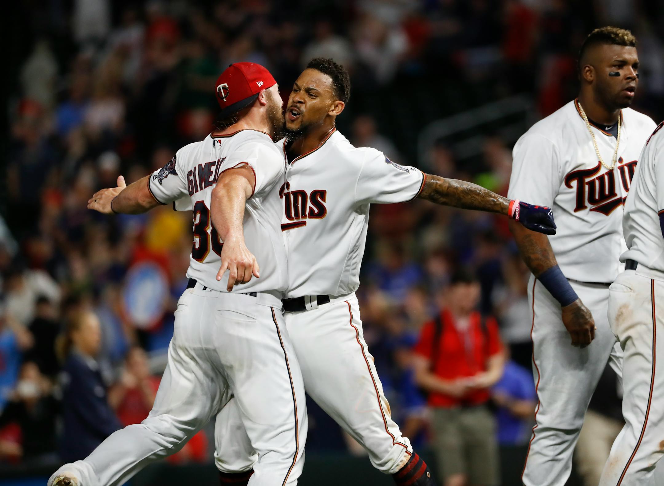 Twins center fielder Byron Buxton celebrated his 10th-inning walkoff home run to win Thursday's game 3-2 over Toronto with catcher Chris Gimenez