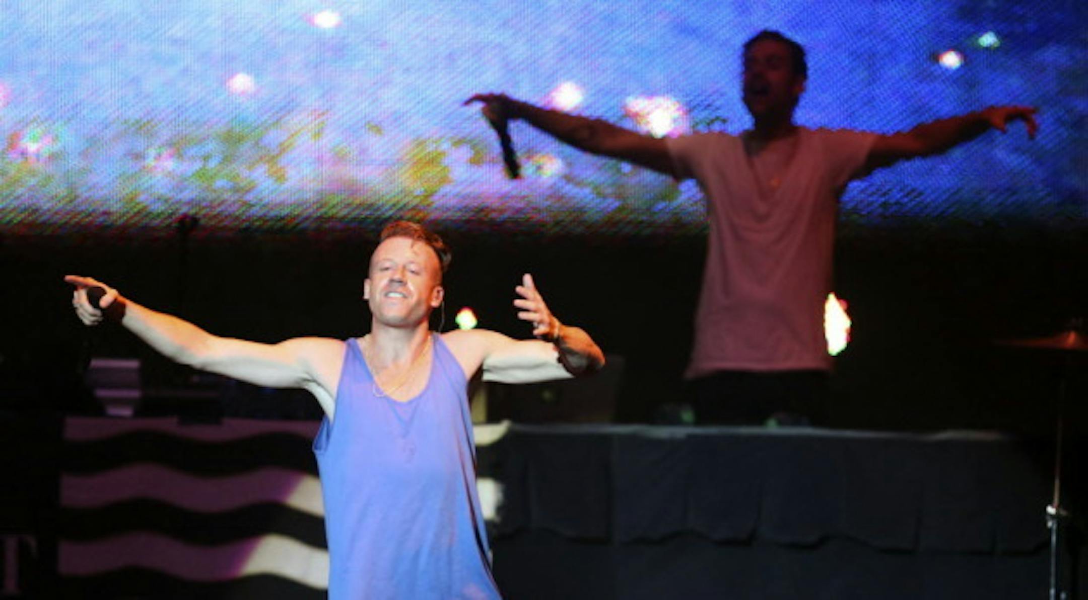 Macklemore, backed by Ryan Lewis, only delivered nine songs in Saturday's fair grandstand concert -- or eight if you don't count "Can't Hold Us" twice. / Kyndell Harkness, Star Tribune