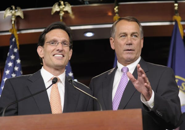 2011 photo: Republican House Speaker John Boehner of Ohio, right, stands with House Majority Leader Eric Cantor of Va..