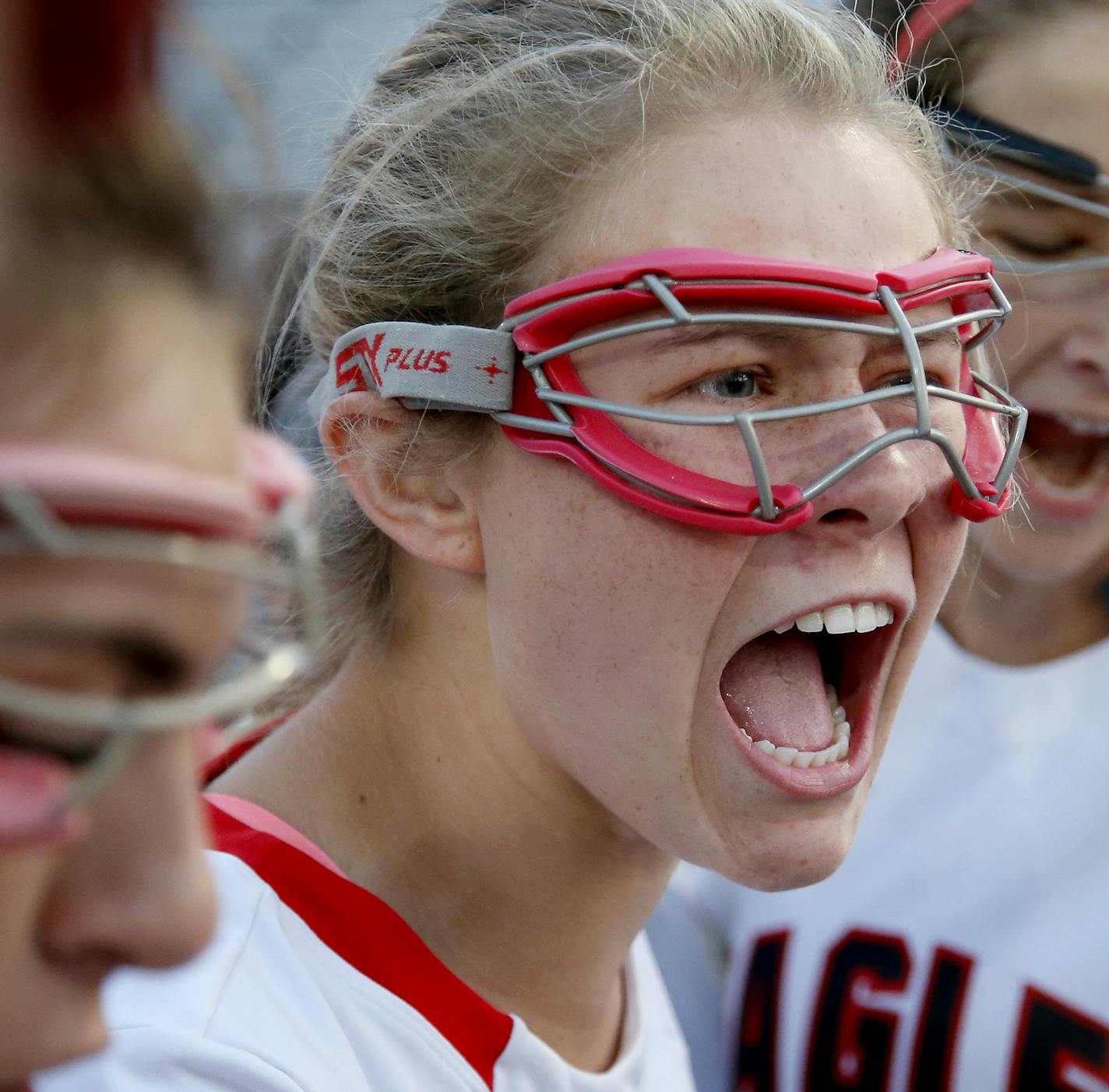 Naomi Rogge (2) and Eden Prairie Lacrosse teammates huddled up before a game against Hopkins. ] CARLOS GONZALEZ cgonzalez@startribune.com, April 16, 2015, Eden Prairie, MN, Girls lacrosse game. Hopkins at Eden Prairie High School, Prep