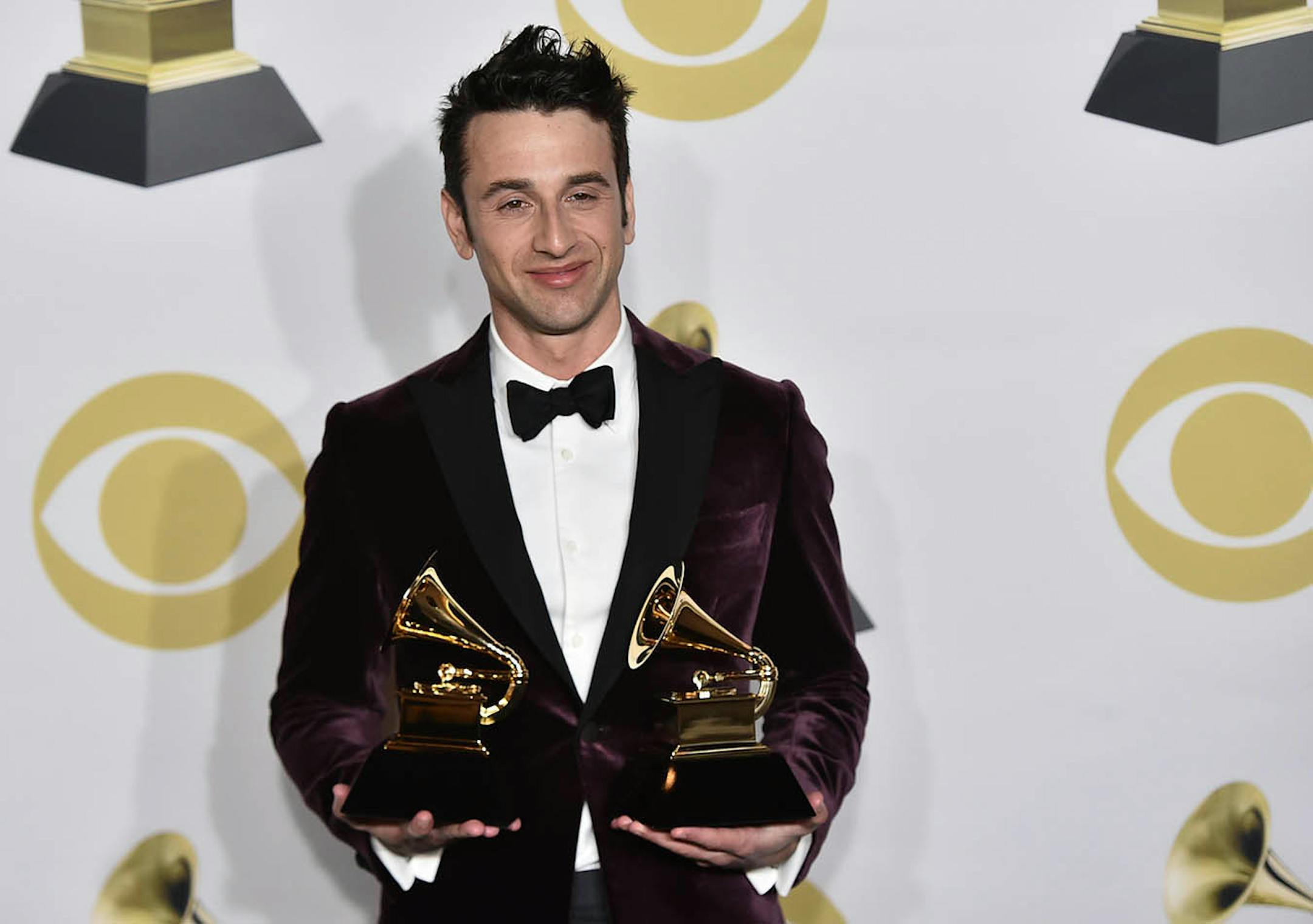 Justin Hurwitz poses in the press room with the best compilation soundtrack for visual media award for "La La Land" at the 60th annual Grammy Awards at Madison Square Garden on Sunday, Jan. 28, 2018, in New York.
